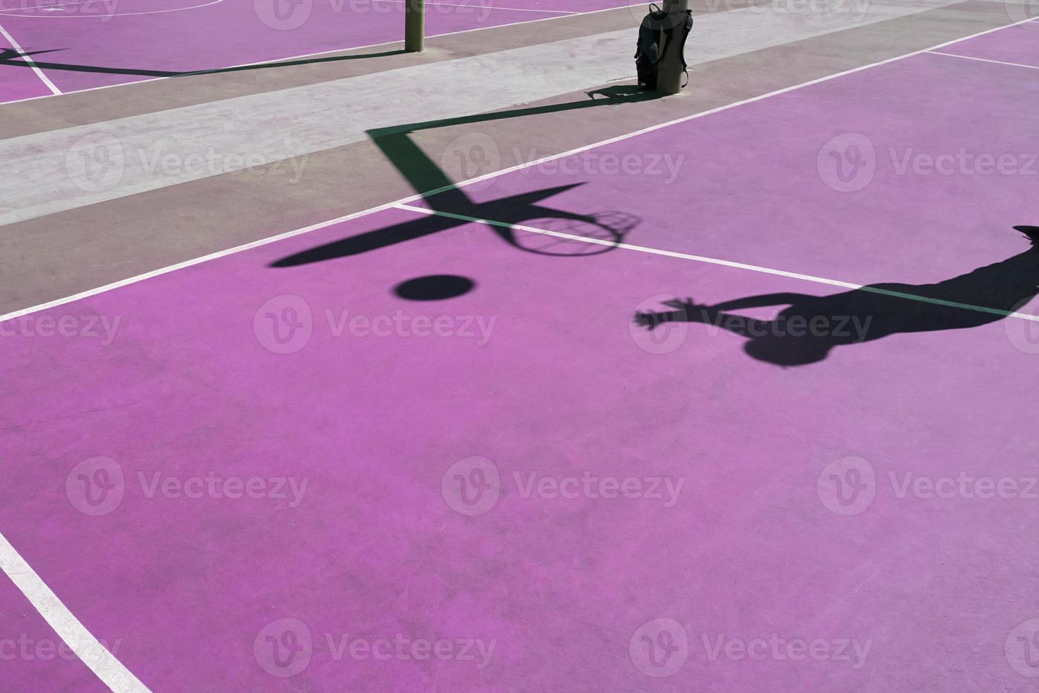 shadows on the purple street basket court, purple background photo