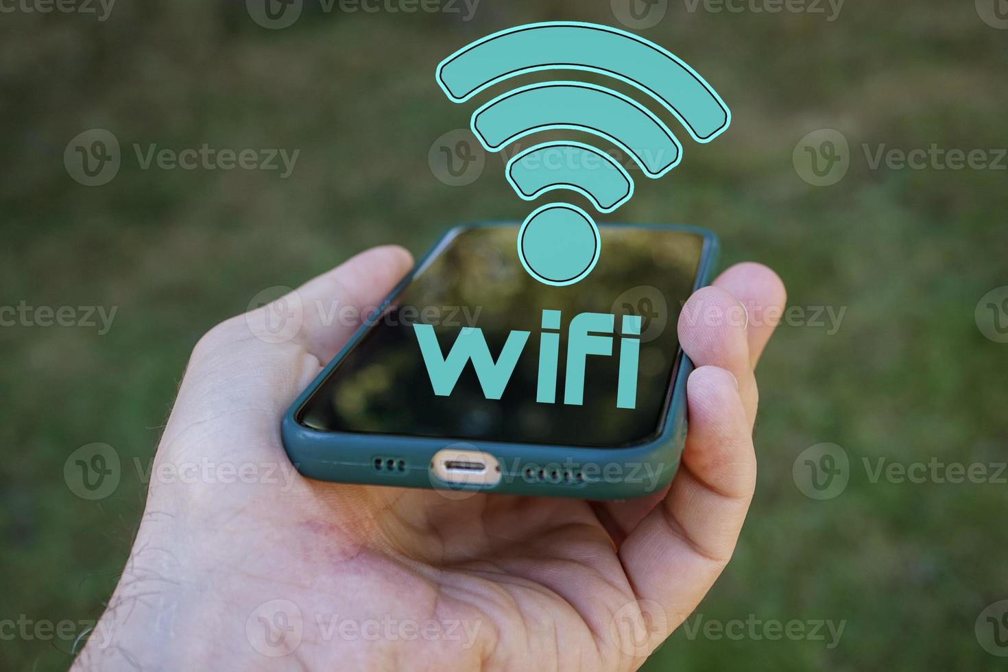 hand holding a smart phone with wifi icon, Wireless Fidelity photo