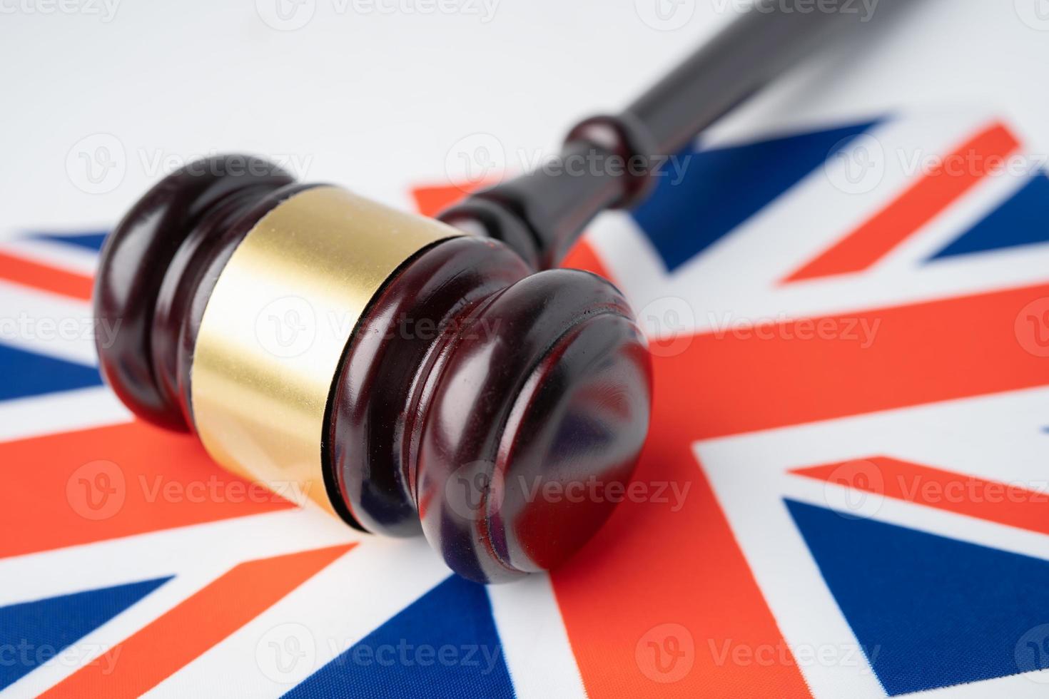 Gavel for judge lawyer on United Kingdom flag, finance concept. photo