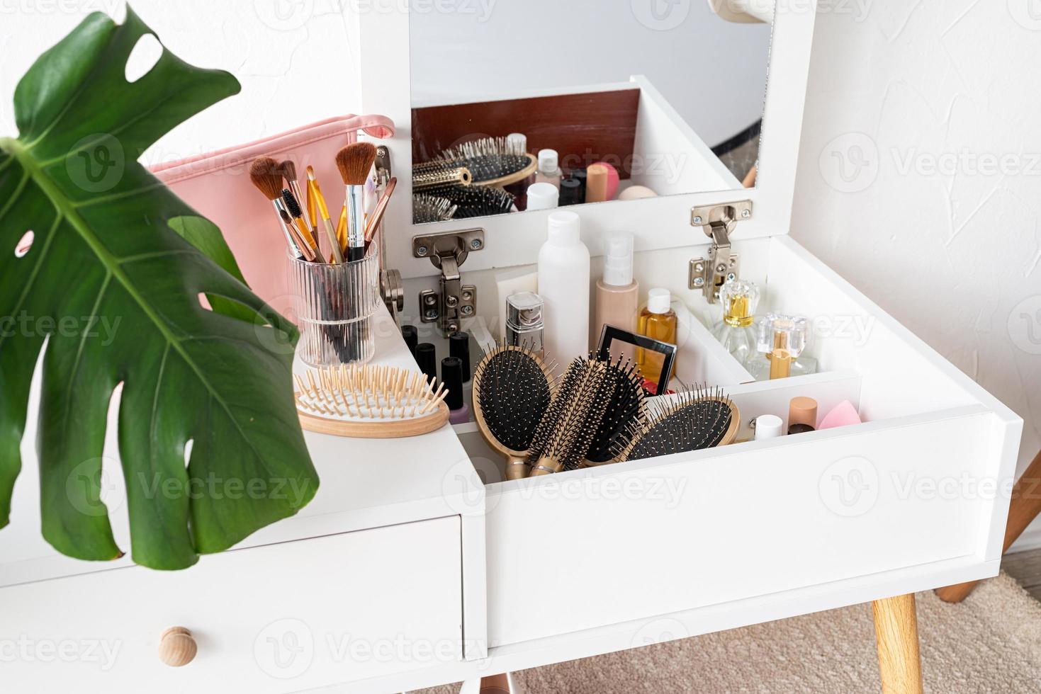 Stylish room interior with elegant dressing table and plants photo