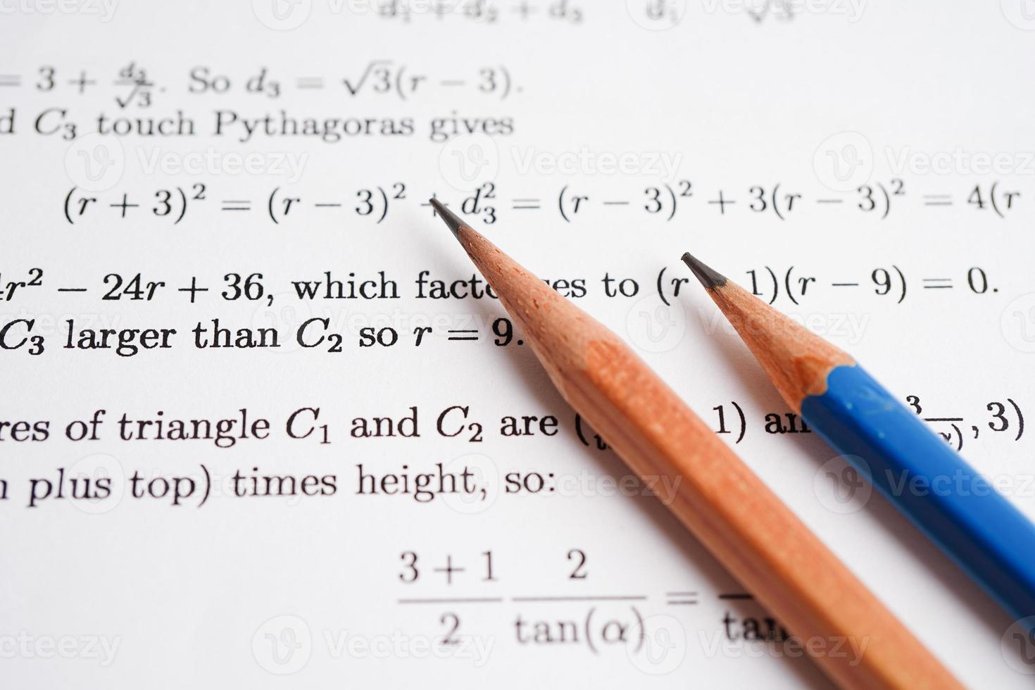 Pencil on mathematic formula exercise test paper in education school. photo