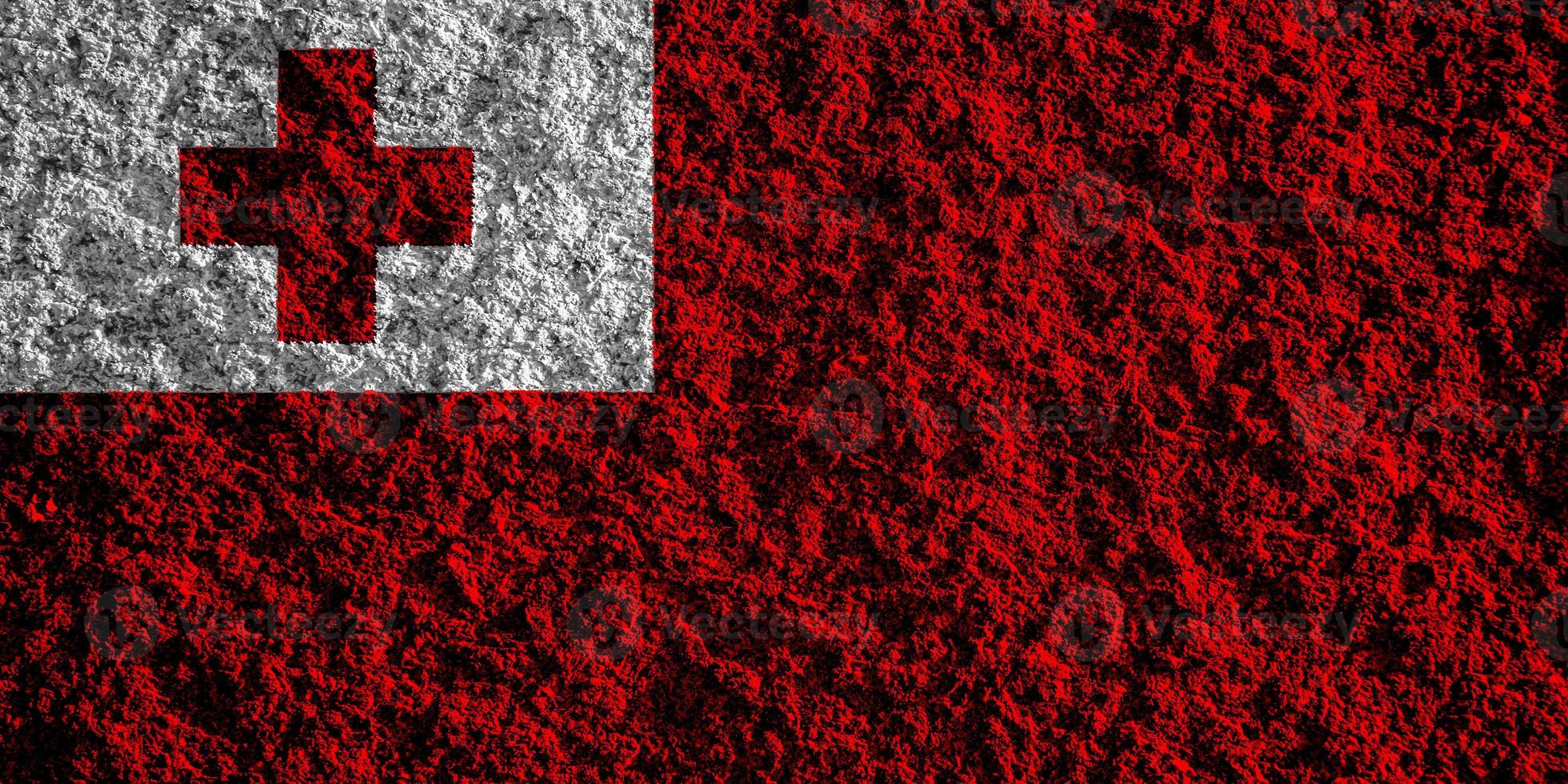 Flag of the Kingdom of Tonga on a textured background. Concept collage. photo