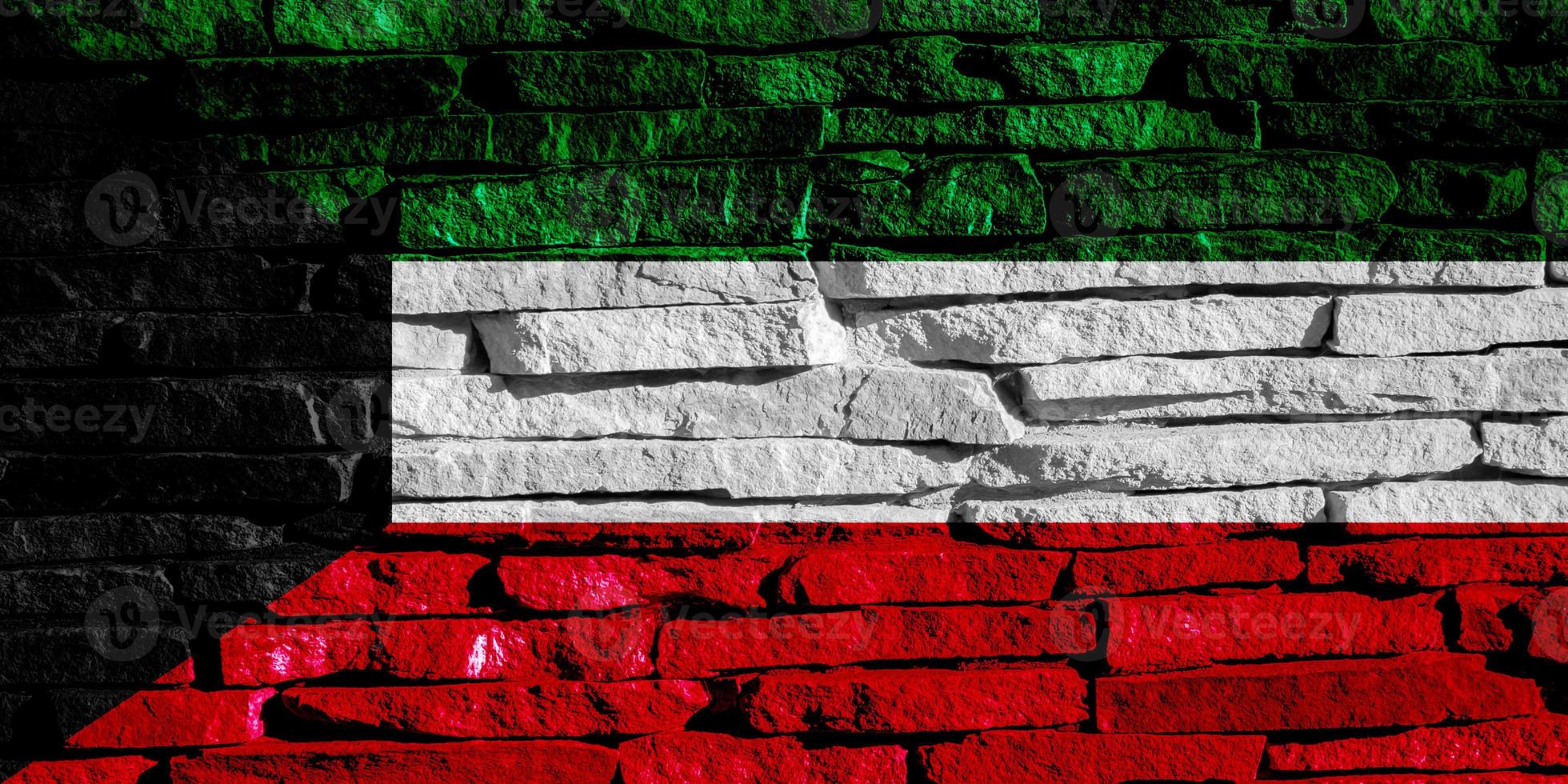 Flag of Kuwait on a textured background. Concept collage. photo