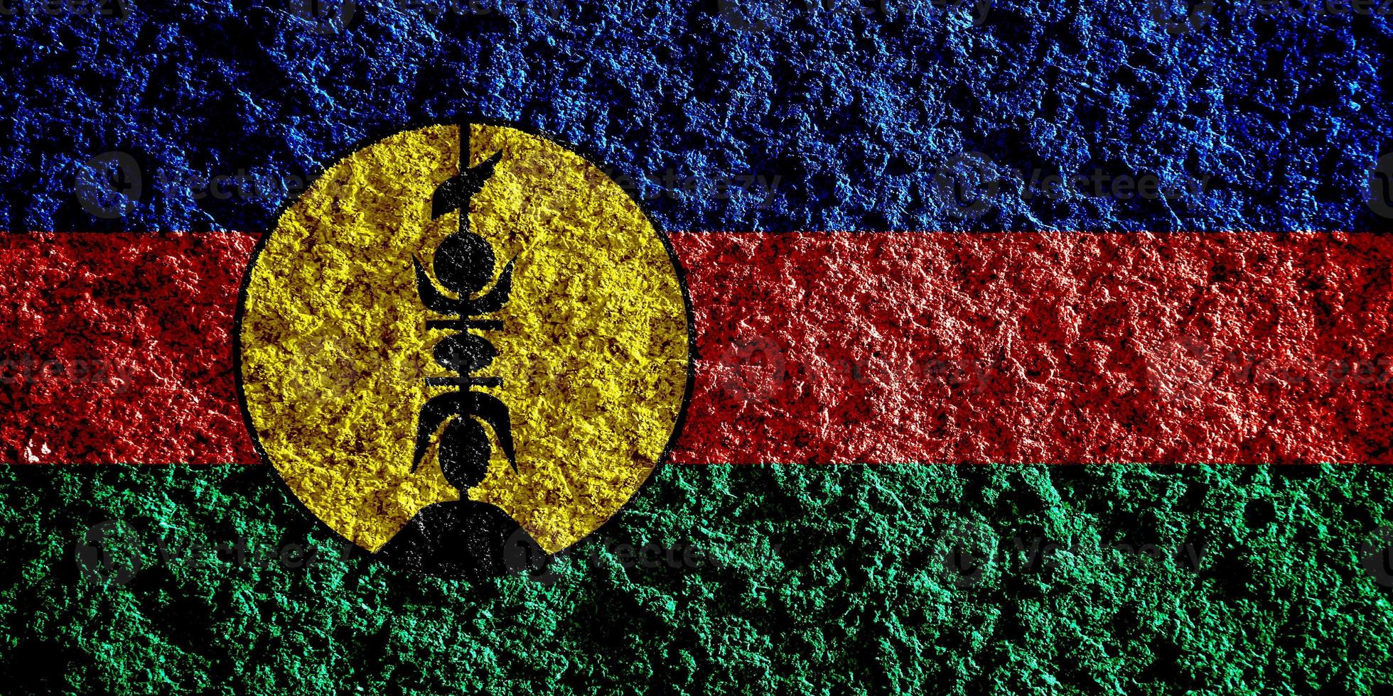 Flag of New Caledonia on a textured background. Concept collage. photo