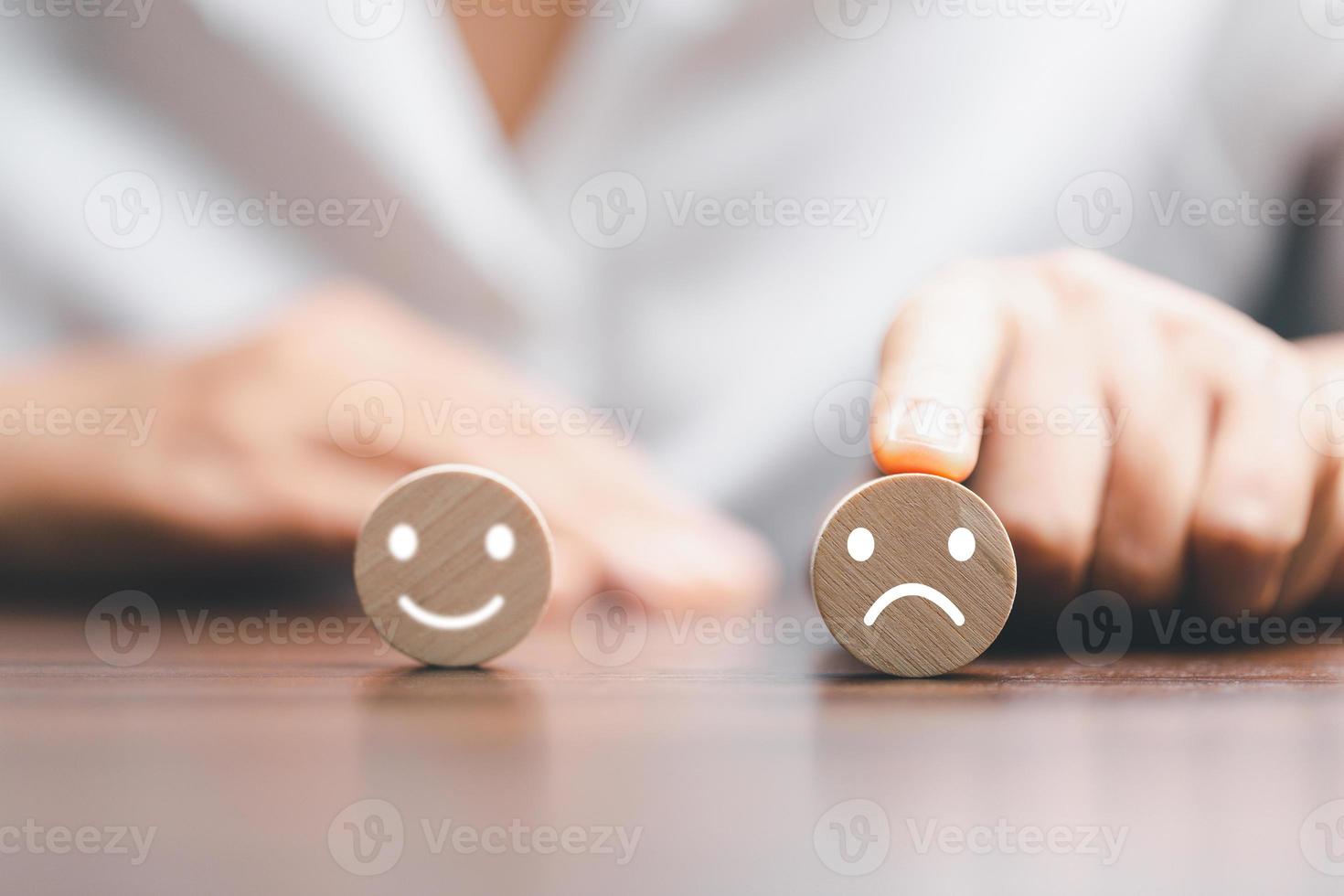 Rating feedback scale on wood cube with copy space. Service rating, dissatisfied with satisfaction concept, Bad review, bad service dislike bad quality, low rating, negative social media not good. photo