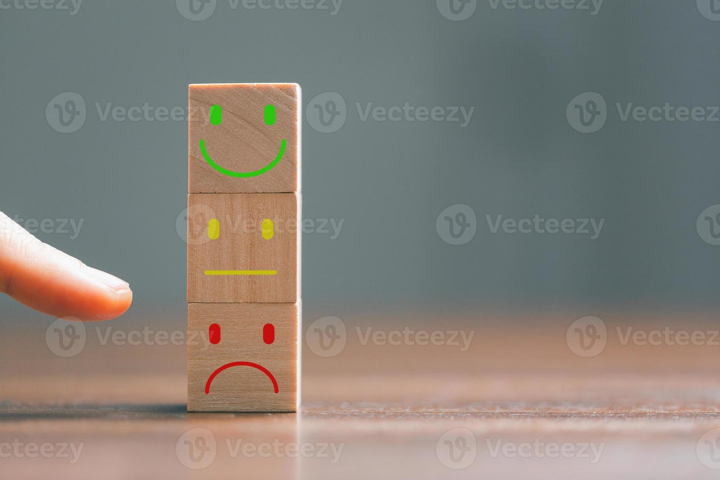 Rating feedback scale on wood cube with copy space. Service rating, dissatisfied with satisfaction concept, Bad review, bad service dislike bad quality, low rating, negative social media not good. photo