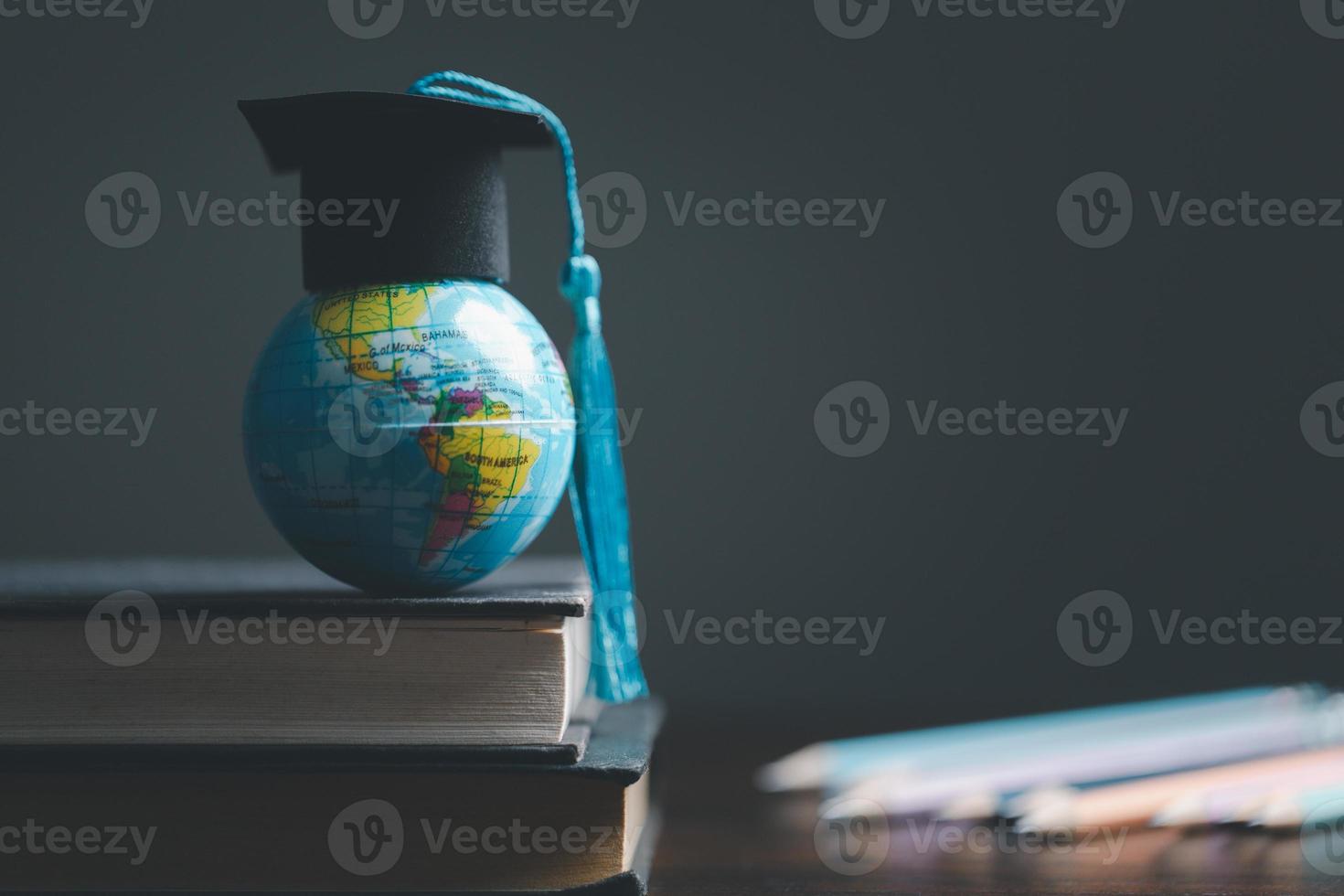 Graduation cap with Earth globe. Concept of global business study, abroad educational, Back to School. Education in Global world, Study abroad business in universities in worldwide. language study photo