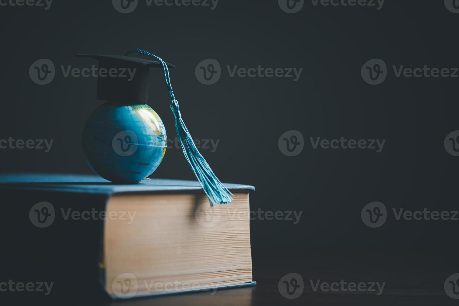 Graduation cap with Earth globe. Concept of global business study, abroad educational, Back to School. Education in Global world, Study abroad business in universities in worldwide. language study photo