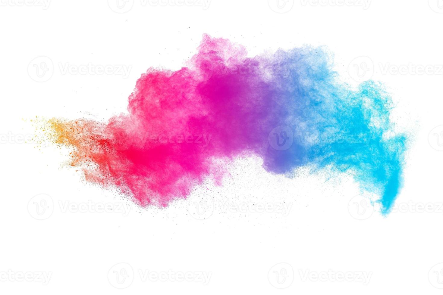 Pastel color dust particle splashing.Colorful powder explosion on white background. photo