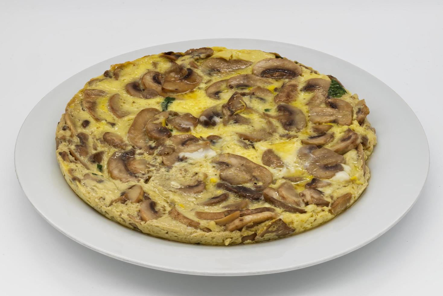 Omelette with mushrooms and cheese on white background. photo