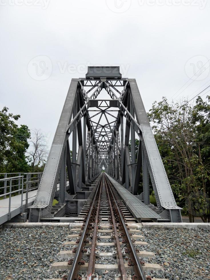 The perspective view of the steel railway bridge. photo