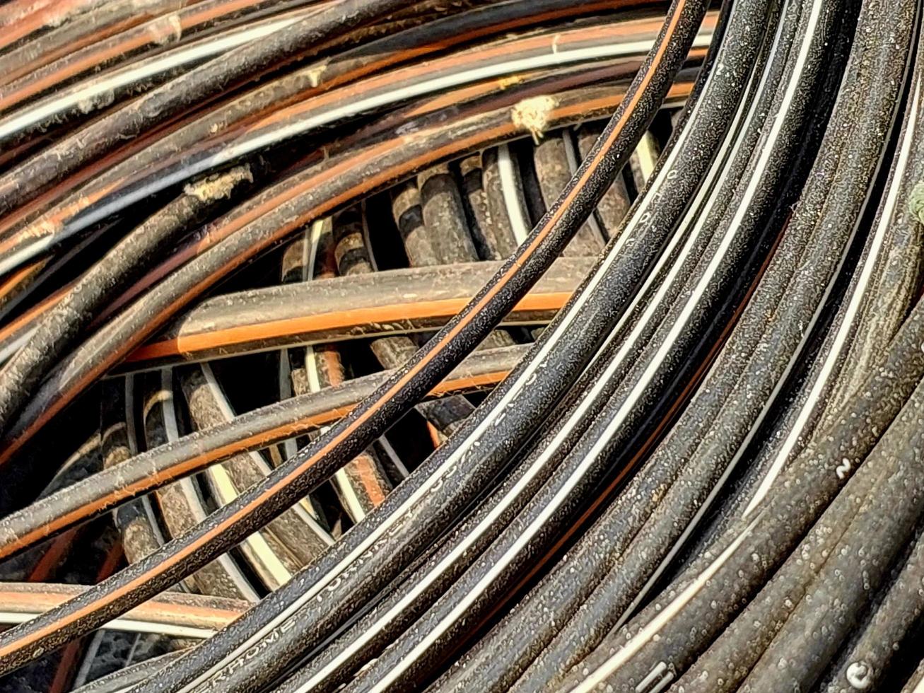 Electric Cable outdoor high-voltage cable wires on a scrap yard. waiting for recycle photo