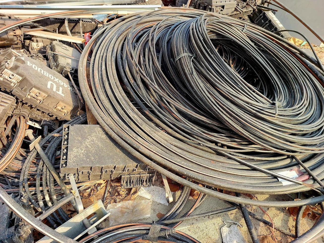 Electric Cable outdoor high-voltage cable wires on a scrap yard. waiting for recycle photo