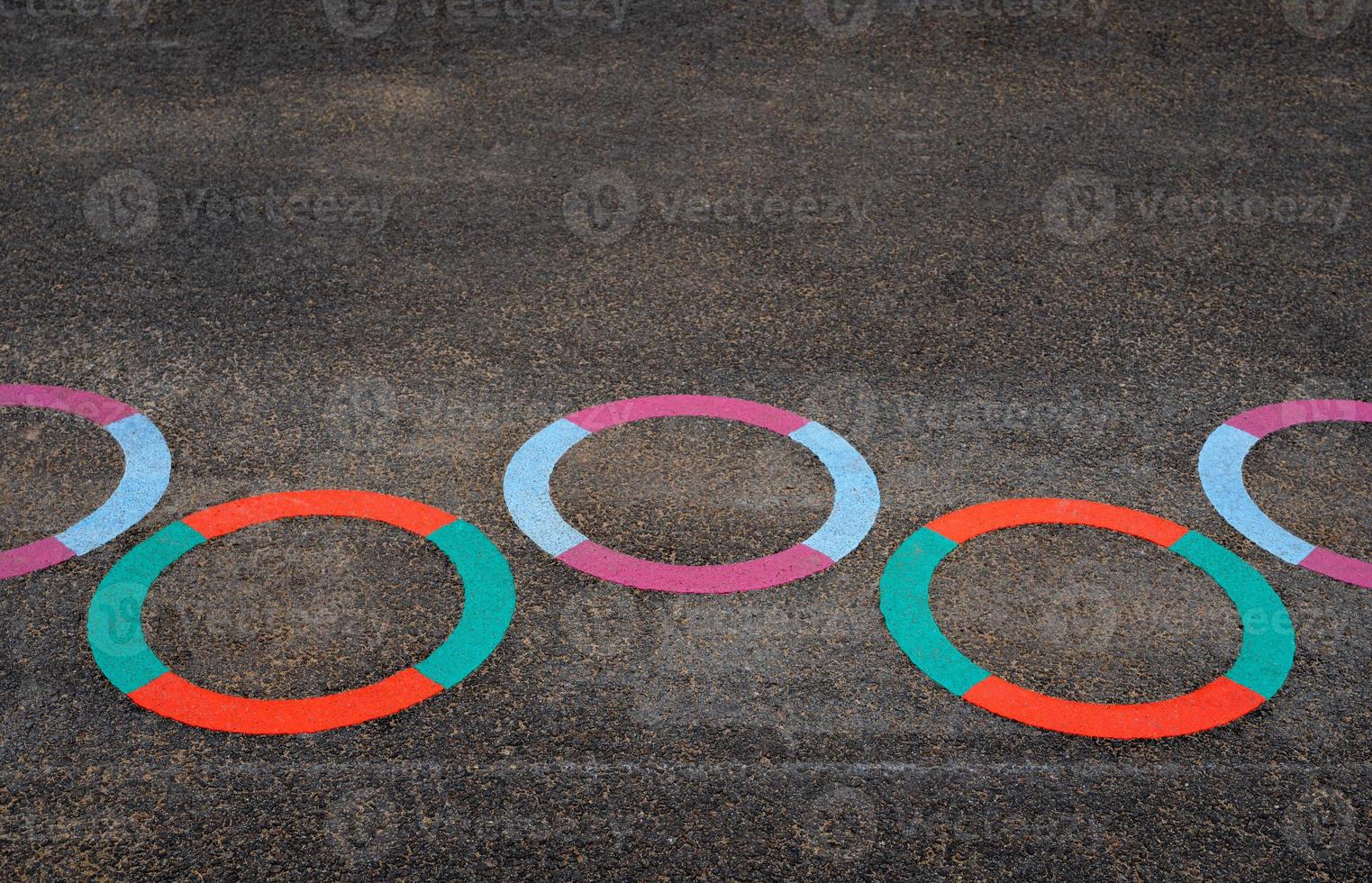 Multicolour Circle on floor in School playground.Bright colored paint on pavement at public Playground, Ourdoor activity for Kids,Learn and Play for Kindergarten school photo