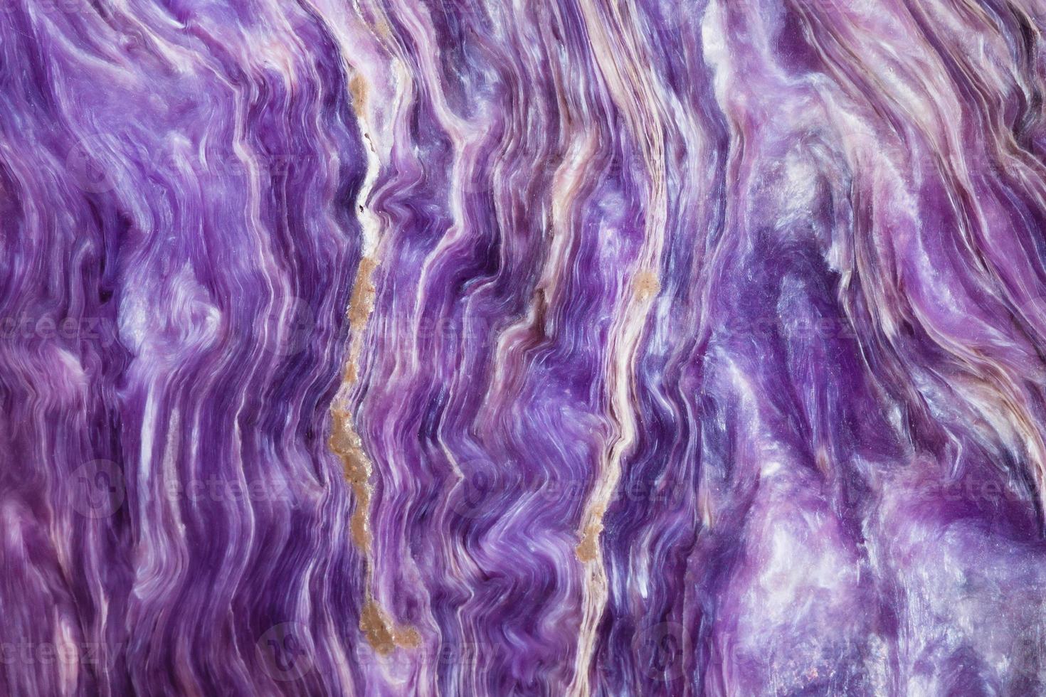 background from polished charoite gemstone photo