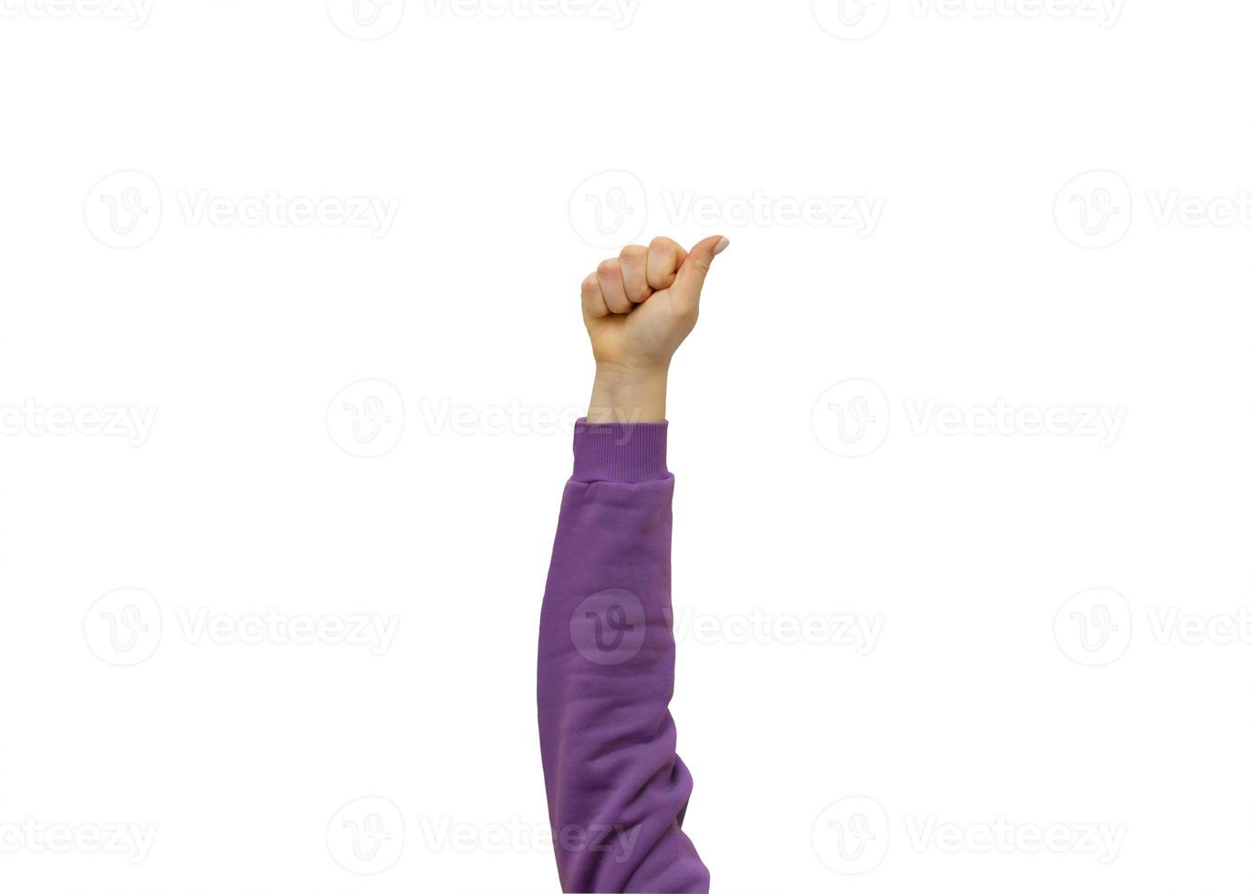 Woman hand with clenched fist on isolated white background. photo