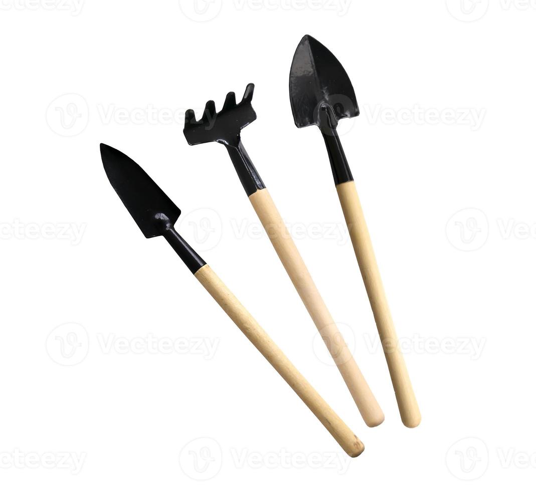 Set of mini gardening tools on white isolated background photo