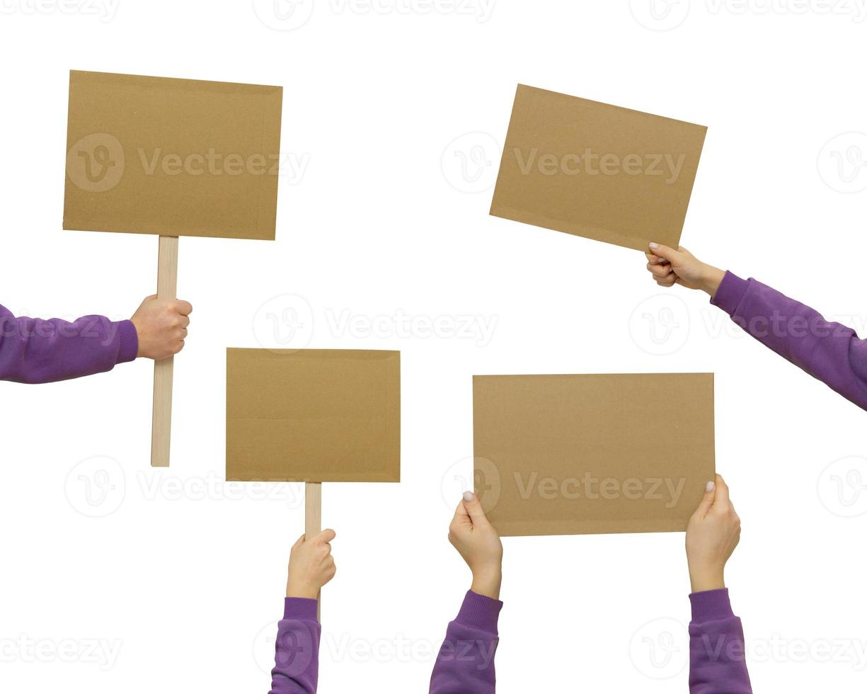 Woman's hand holding blank banner mock up on wood stick isolated. Empty board plank with space for shouting text rule or protest word. photo
