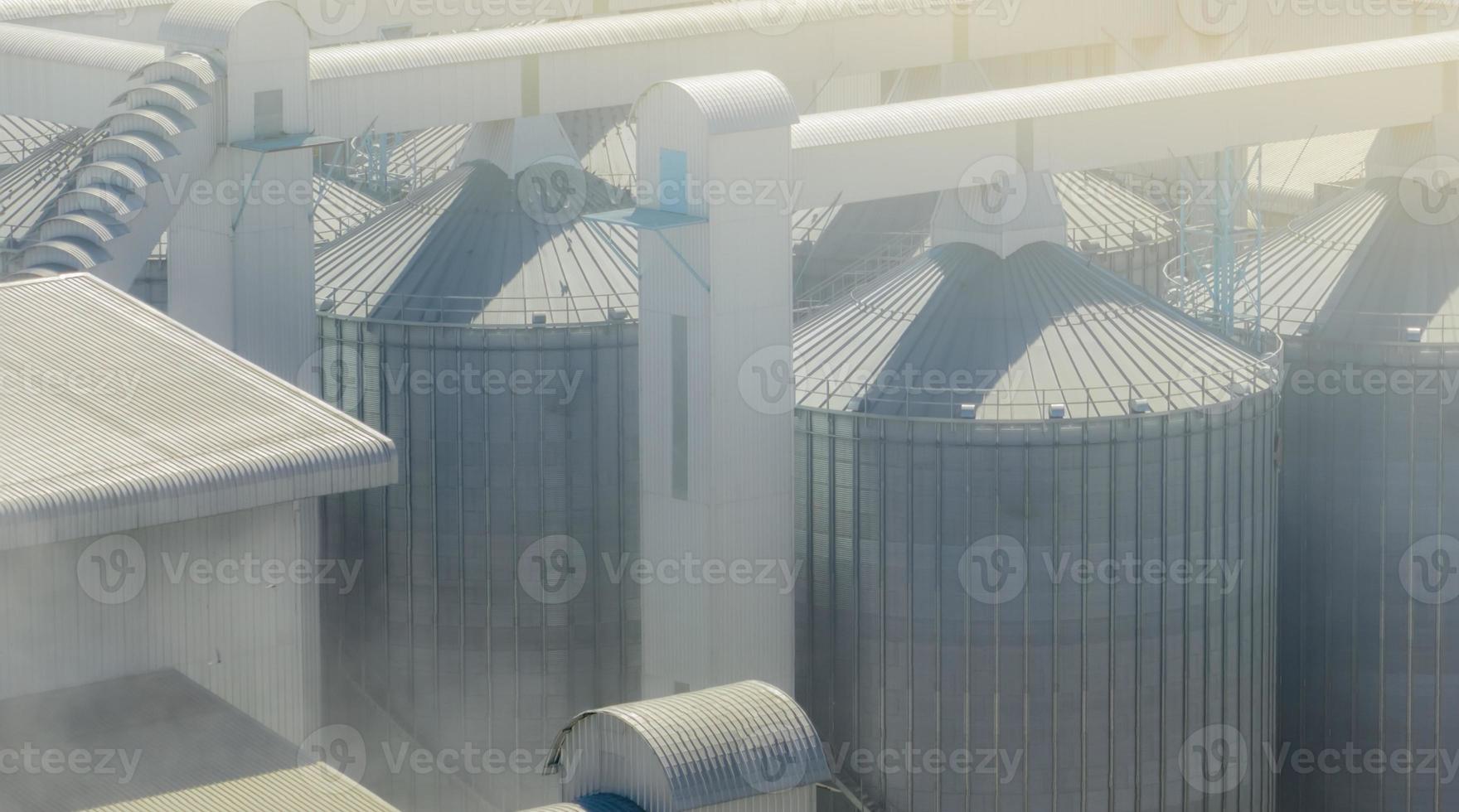 Animal feed factory. Agricultural silo at feed mill factory. Tank for