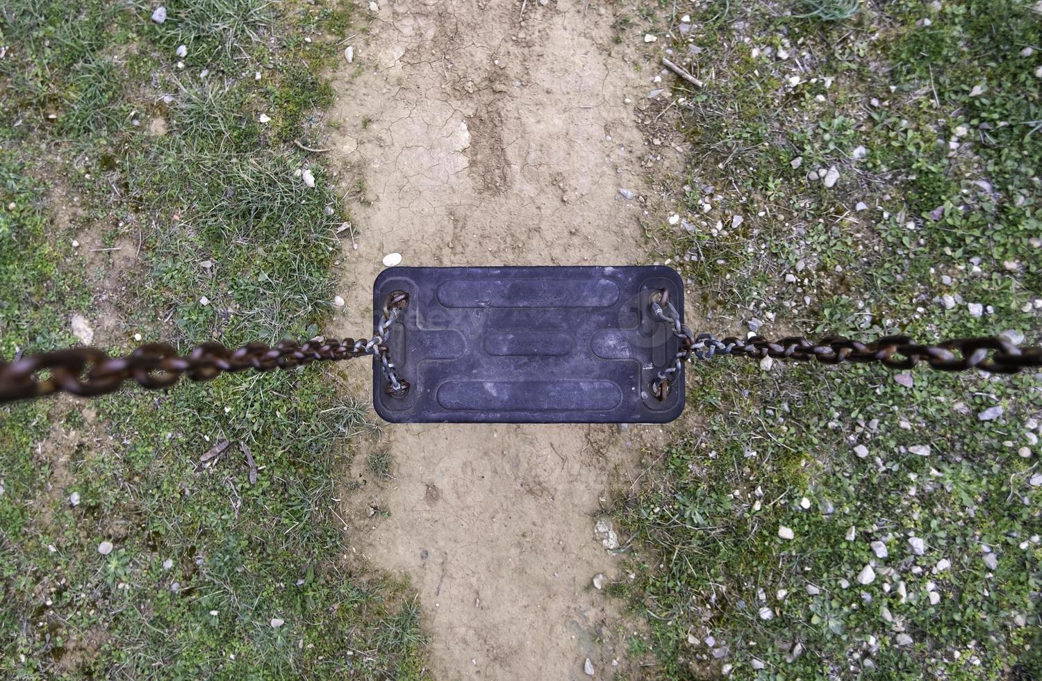 Swings in a playground photo