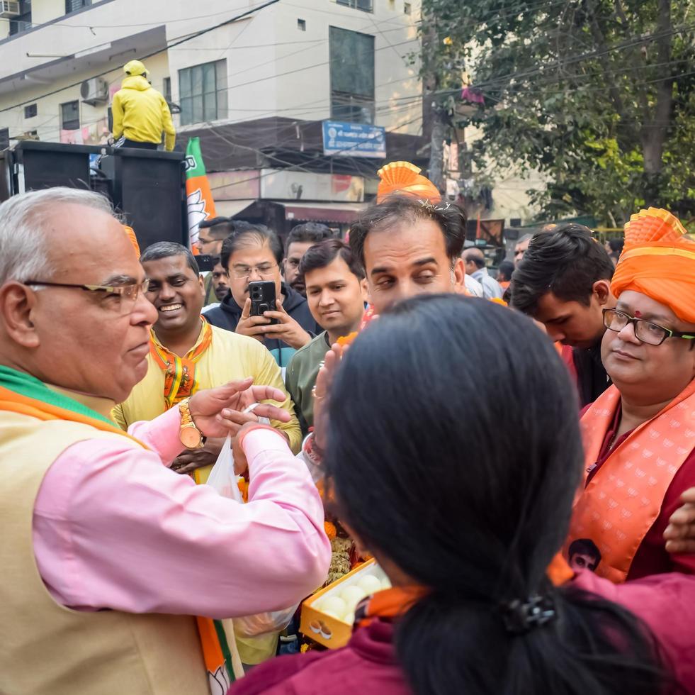 Delhi, India, December 02 2022 -Bharatiya Janata Party BJP supporter during mega road show in support of BJP candidate Pankaj Luthara to file nomination papers ahead of MCD local body Elections 2022 photo