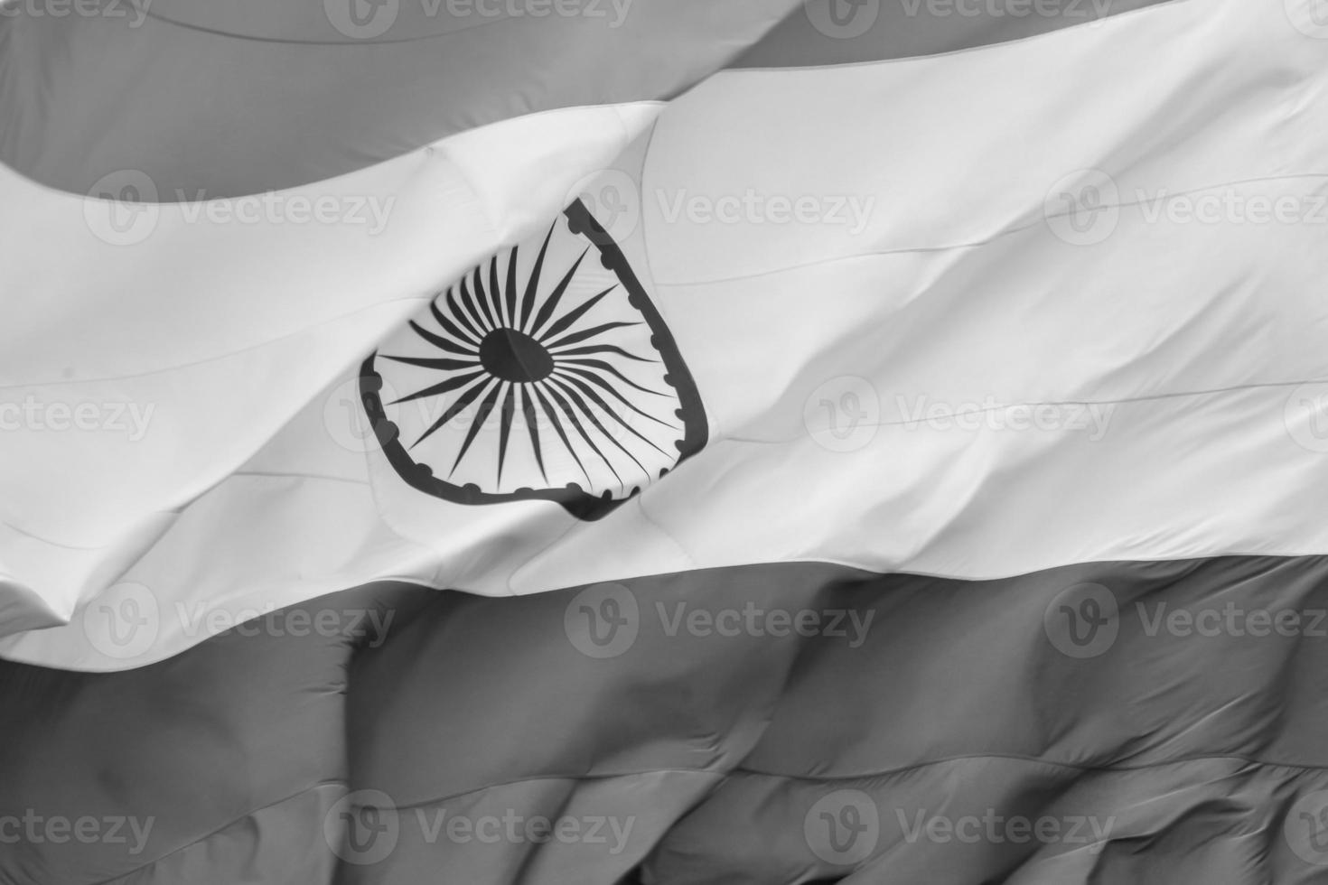 India flag flying high at Connaught Place with pride in blue sky, India flag fluttering, Indian Flag on Independence Day and Republic Day of India, tilt up shot, Waving Indian flag, Har Ghar Tiranga photo