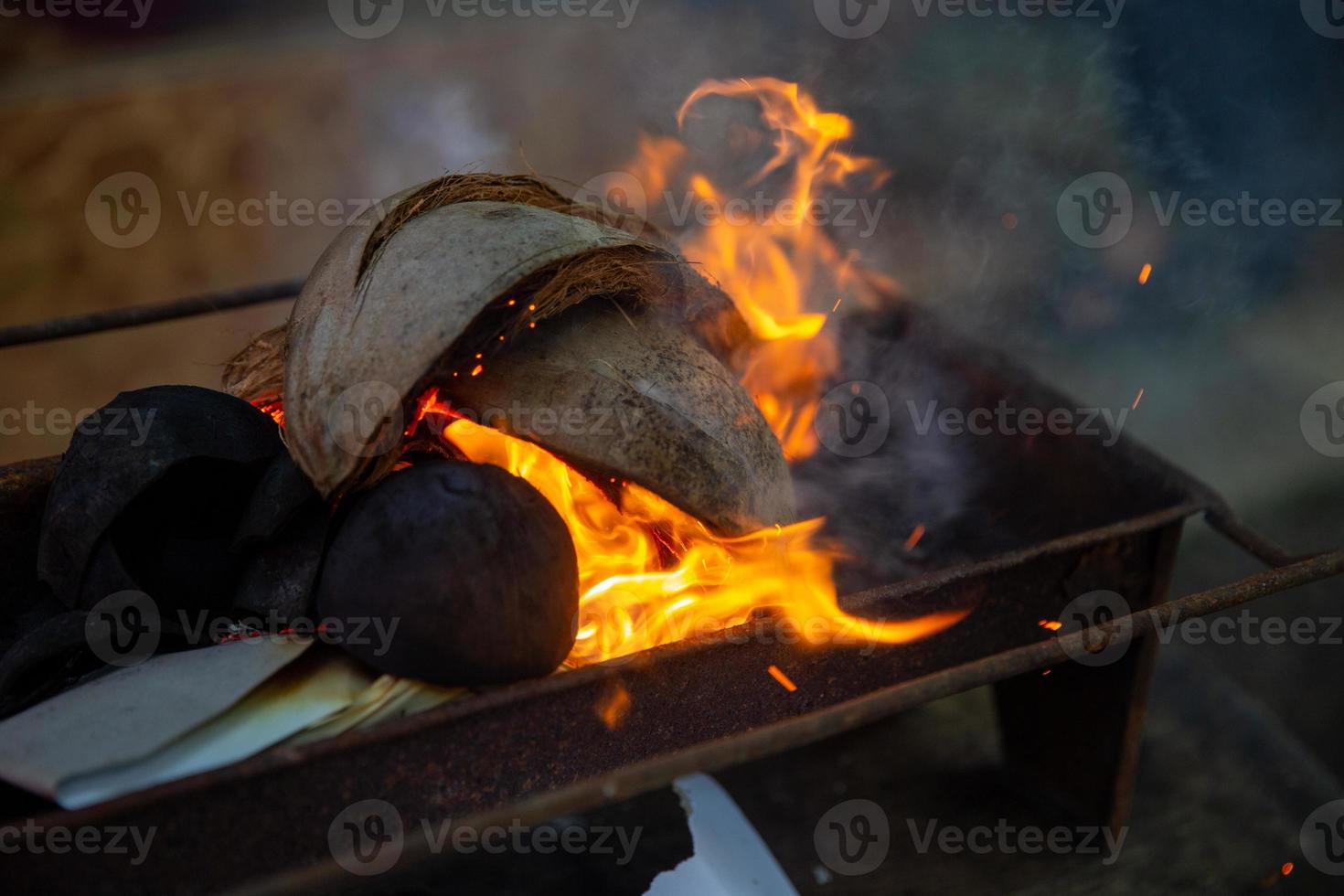 Coconut shell on the grill 20825362 Stock Photo at Vecteezy