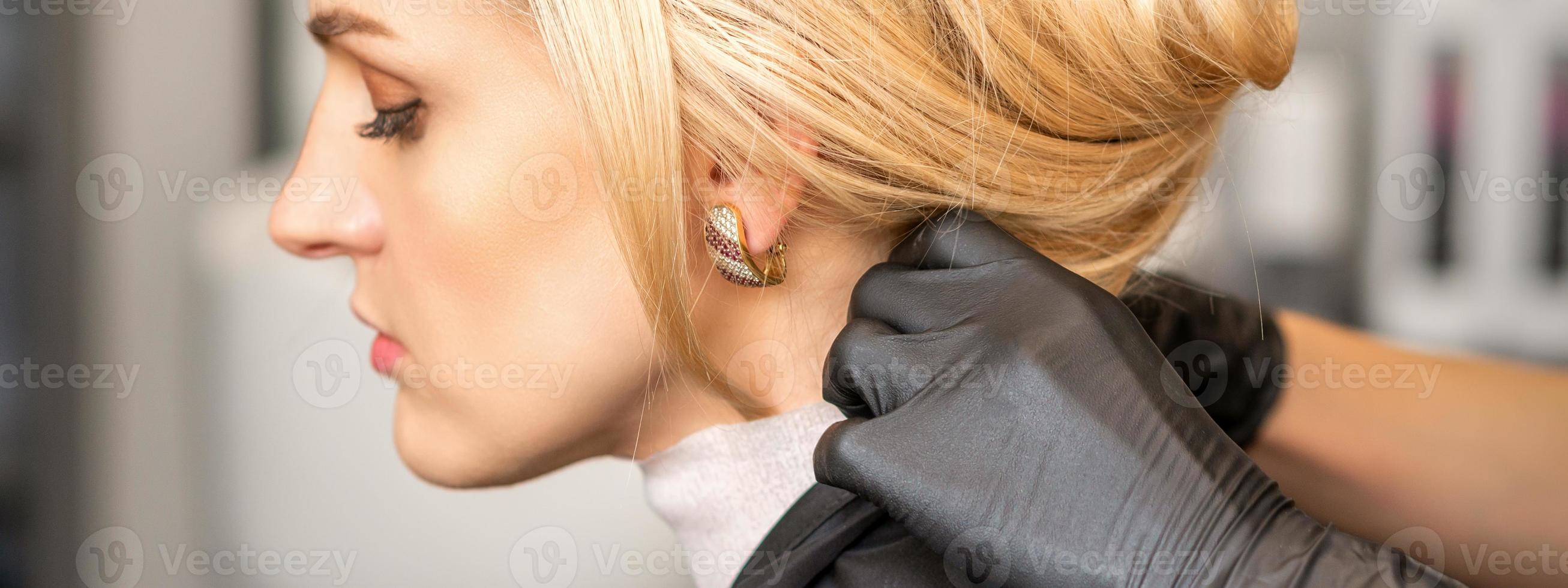 Hairdresser making preparation to woman photo