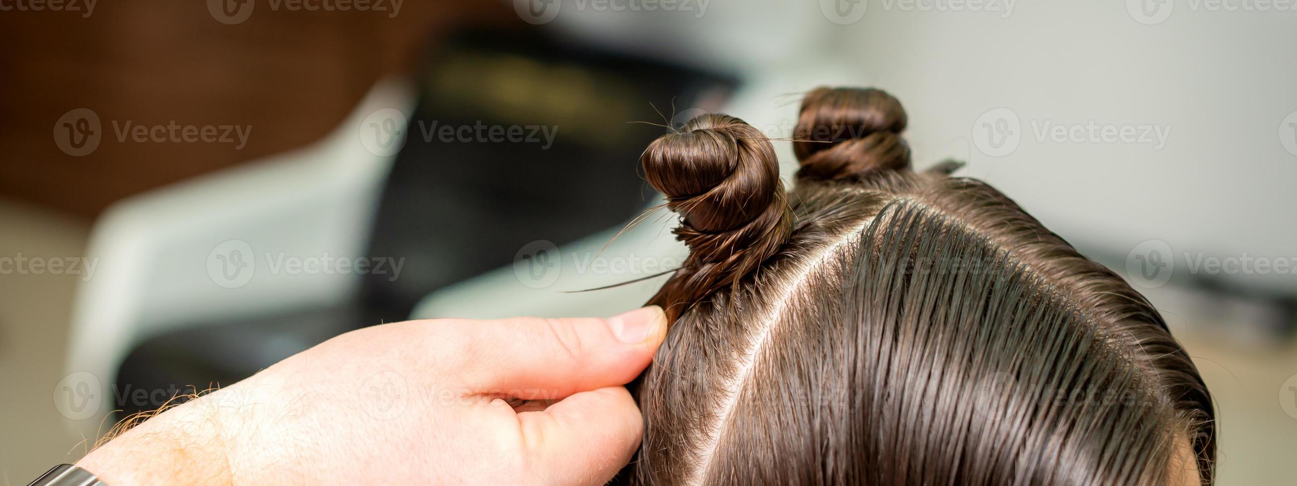 Young woman receives process of hairstyle photo