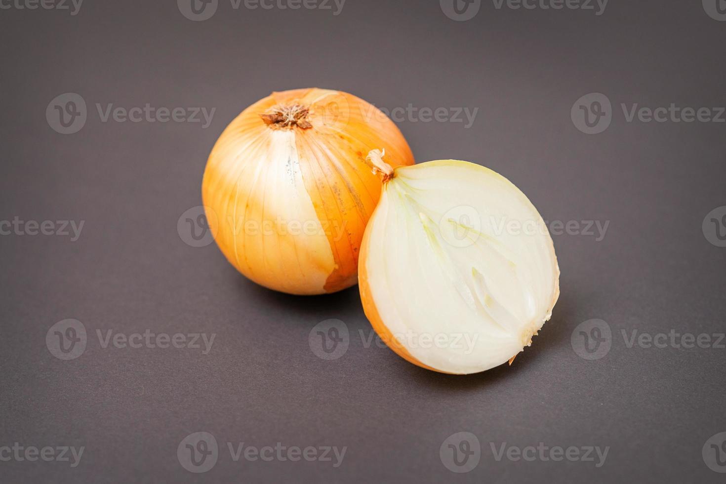 Whole and half raw yellow onions 20825928 Stock Photo at Vecteezy