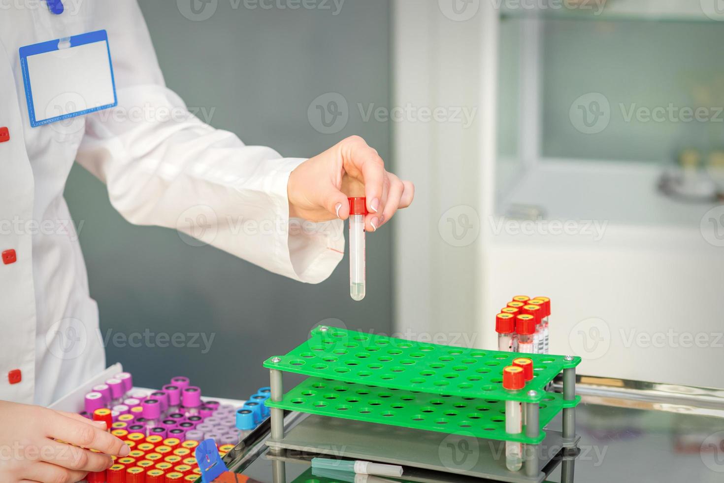 Nurse takes empty blood test tube photo