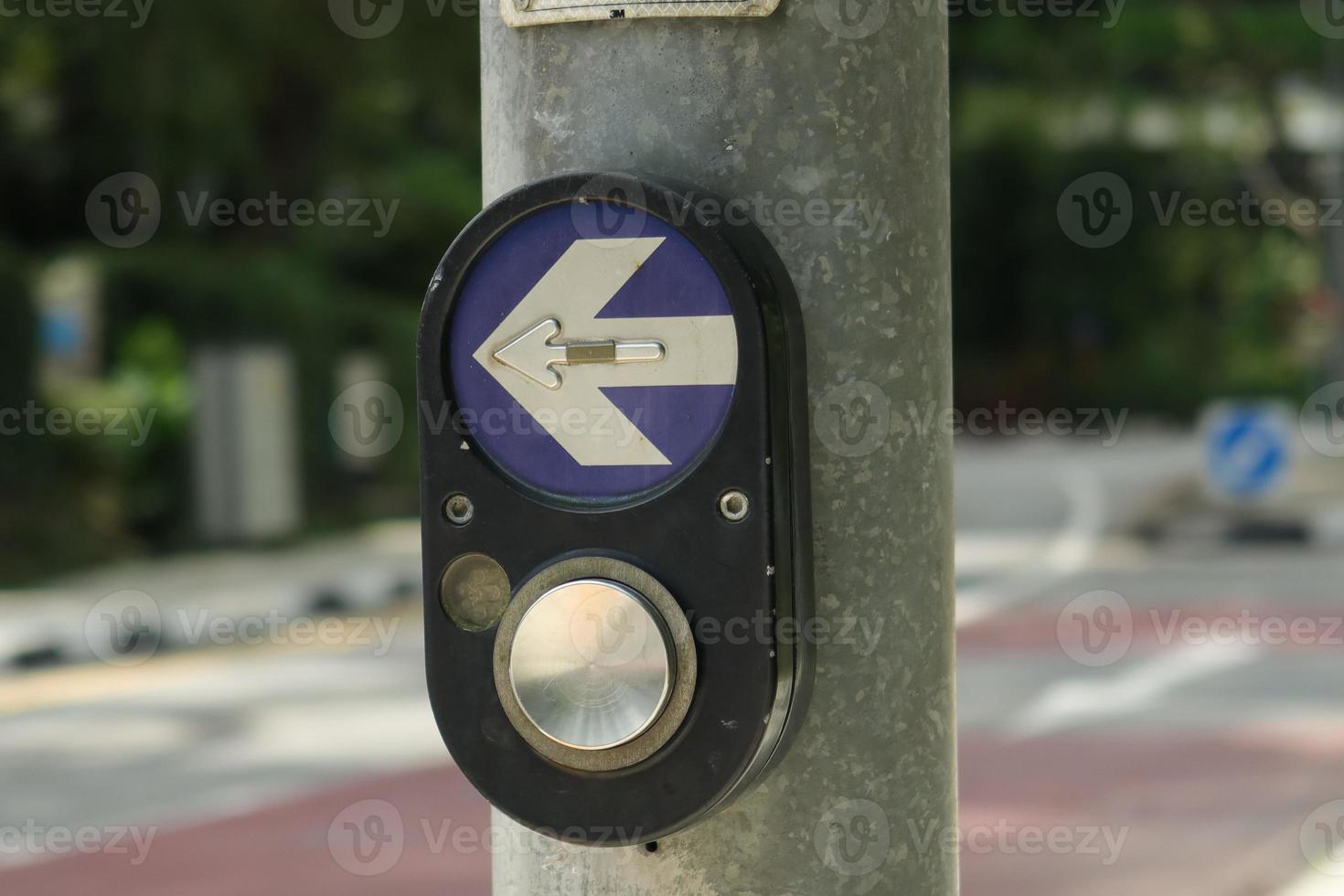 close up of crossing signal button in singapore photo