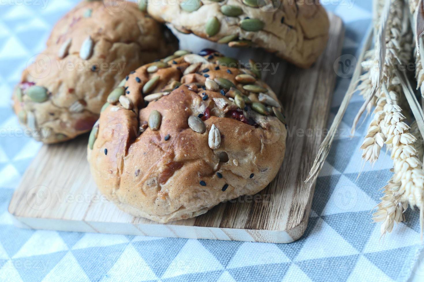 detail shot of sunflower seed baked bread on table photo