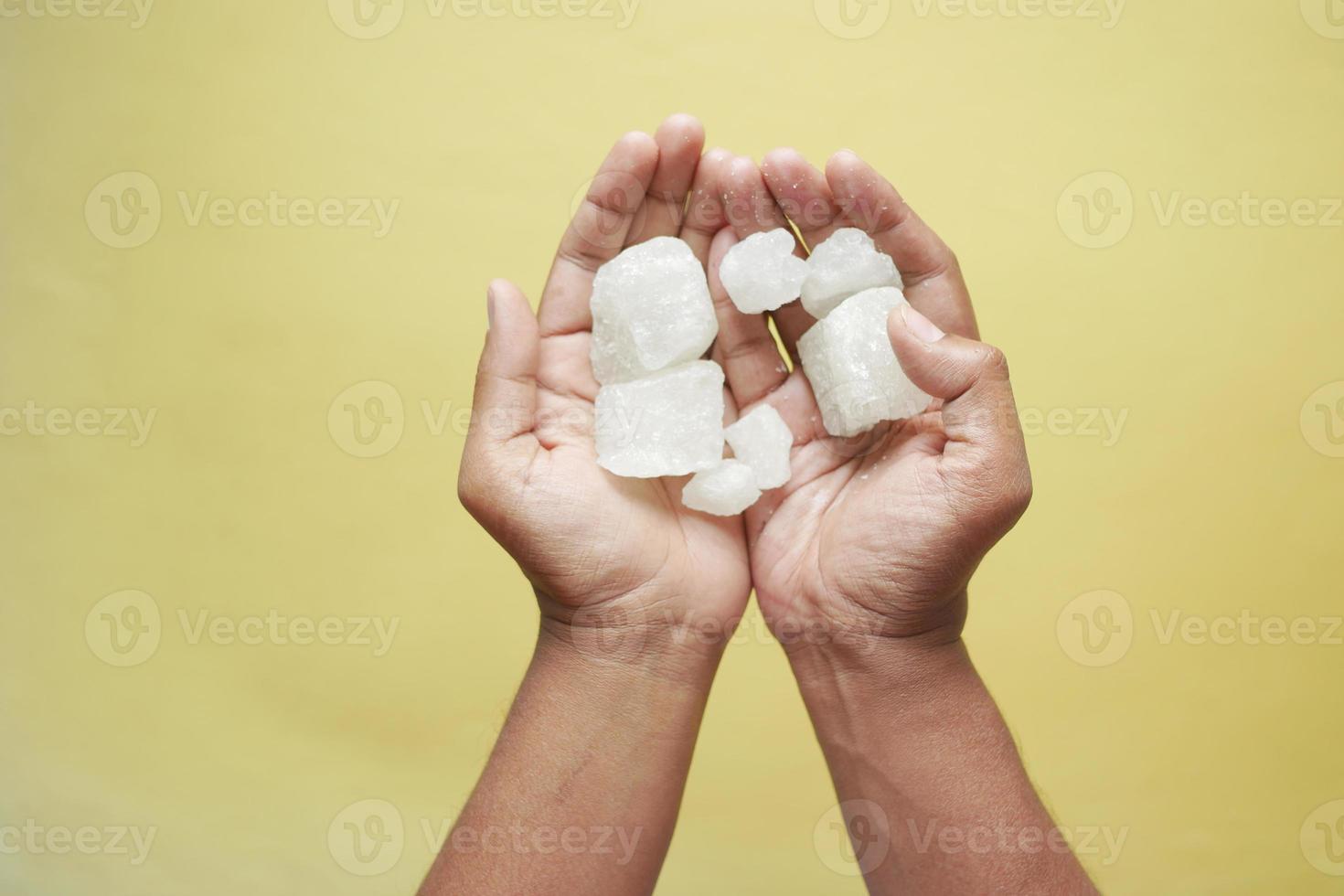 sugar candy on hand top view photo