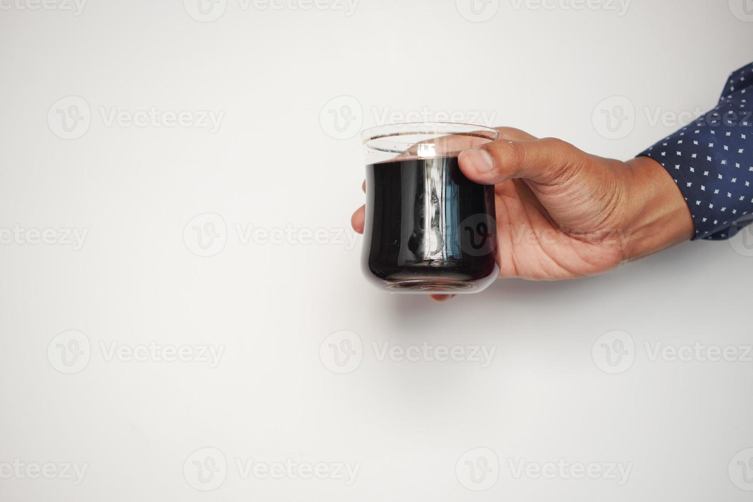 men holding a glass of soft drinks against white background photo