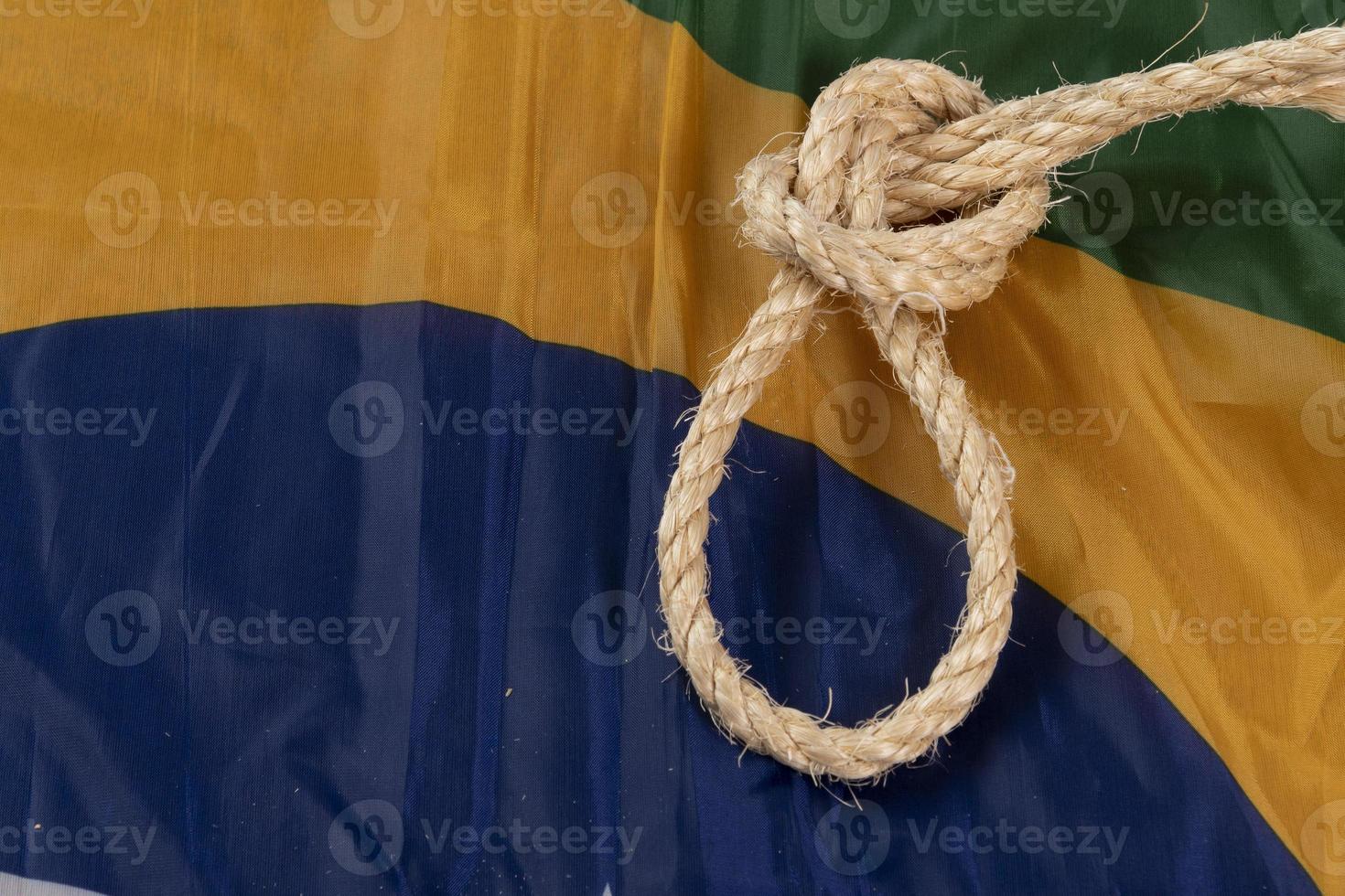 Rope with a noose over the Brazilian flag symbolizing slavery photo