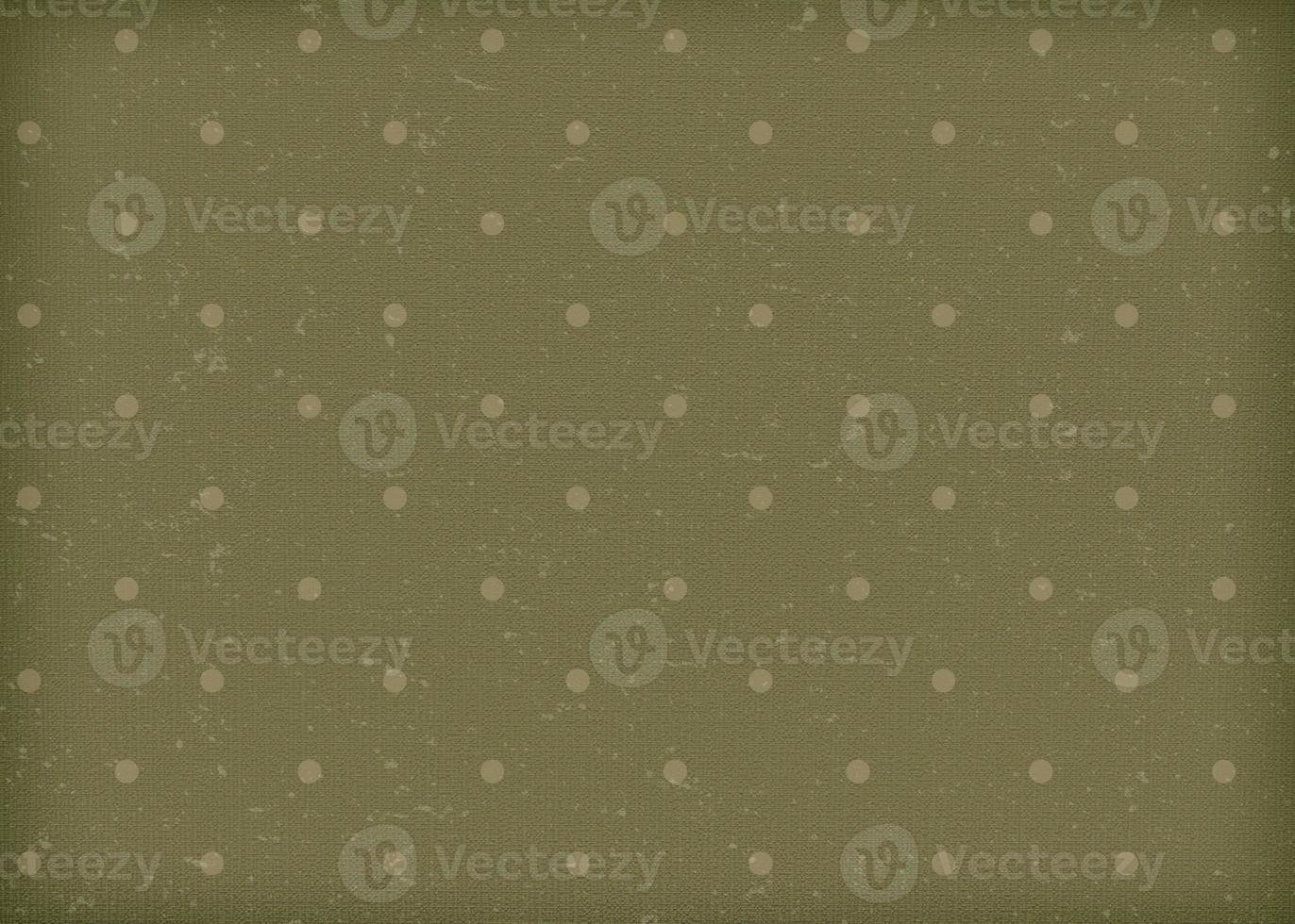 Vintage green paper with white polka dots. Old worn paper wallpaper in a grassy muted color. photo