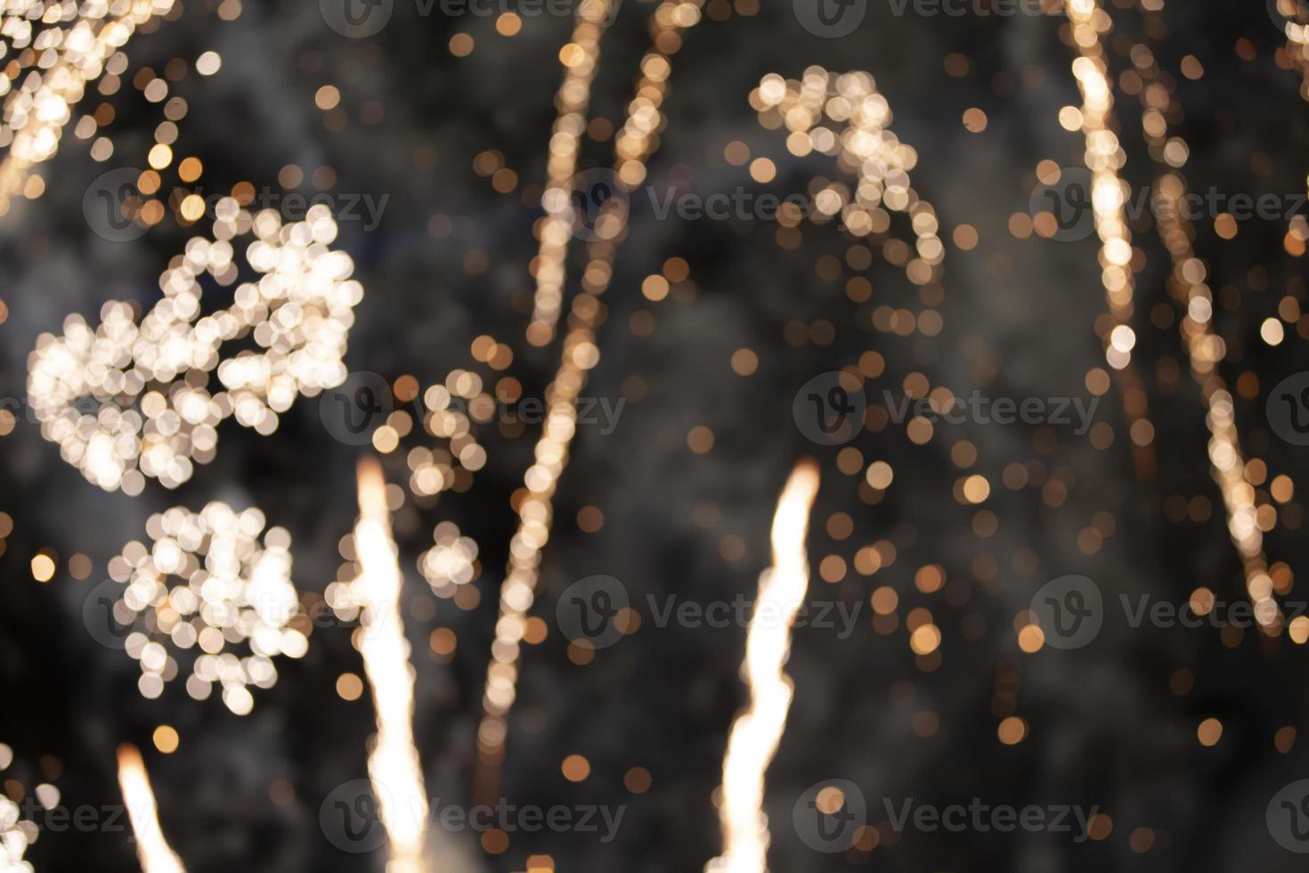 On a black background bokeh from explosions of colorful fireworks. photo