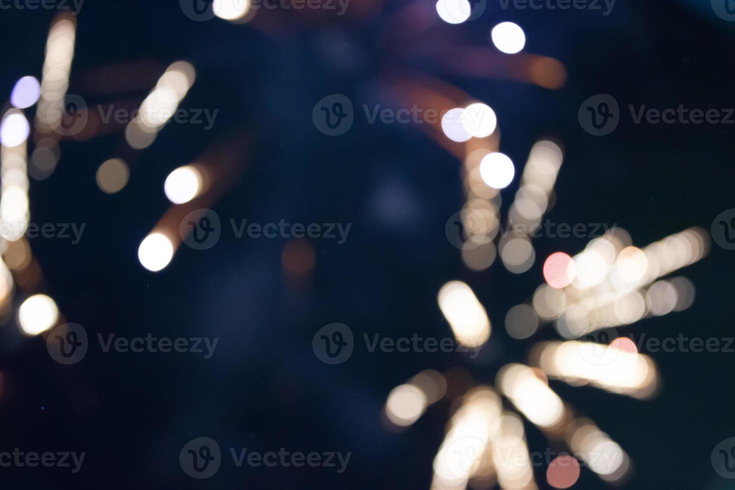 On a black background bokeh from explosions of colorful fireworks. photo