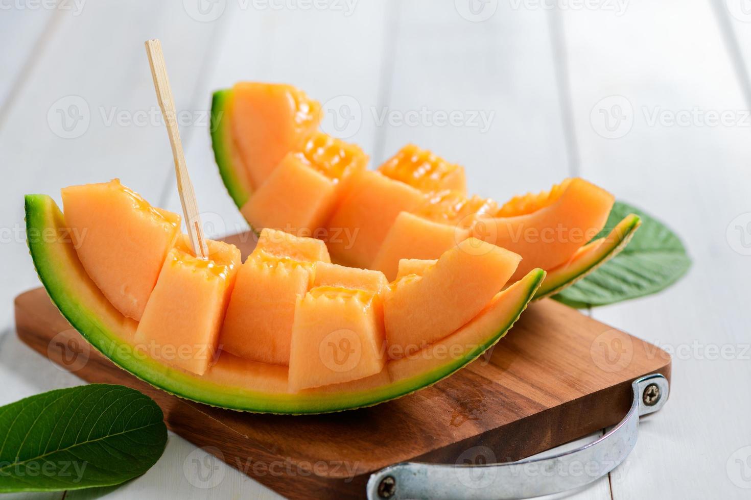 slice of japanese melons, orange melon or cantaloupe melon on white