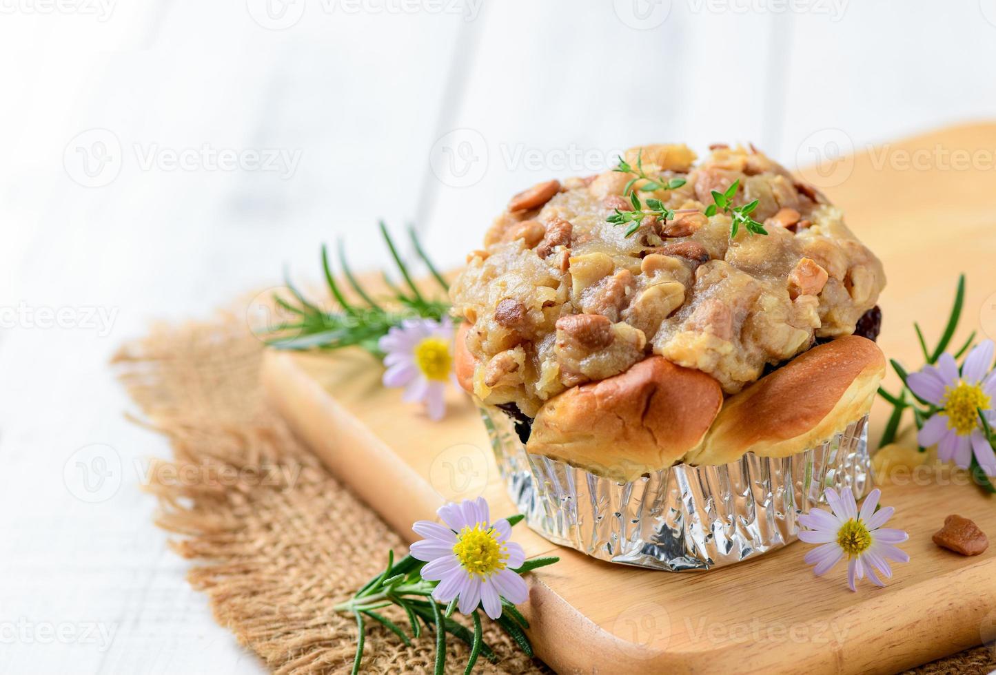 Butterscotch Bread with nuts on top on wood plated photo