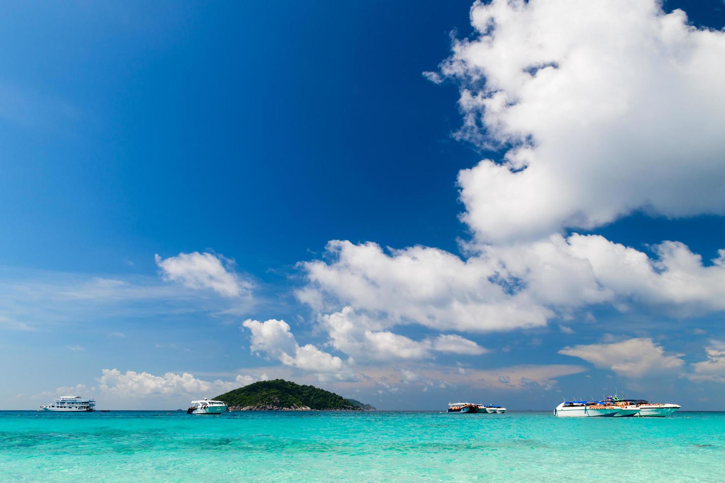 beautiful white cloudy and blue  sky with speed boat and sea on summer at Similan Island, Thailand. photo
