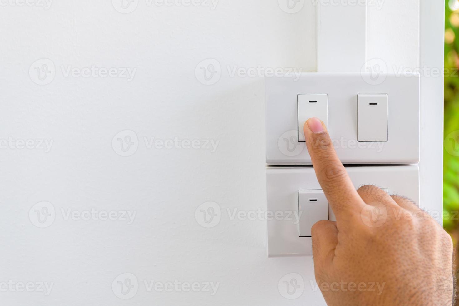 Press turn on or off electrical switch, save electricity and energy photo