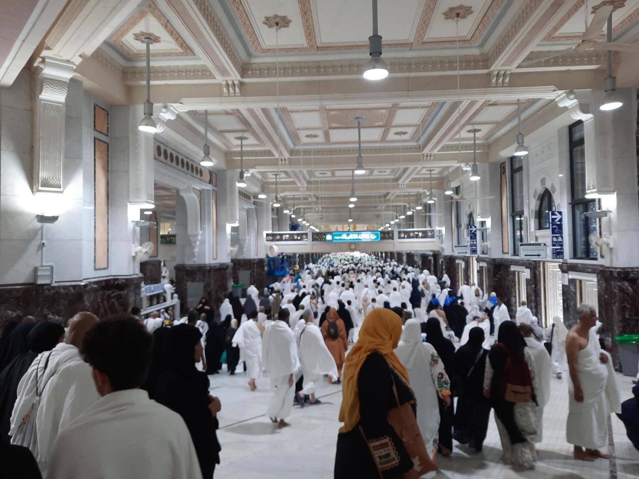 Mecca, Saudi Arabia, Feb 2023 - Pilgrims walk between the hills of Safa and Marwah during Umrah at the Masjid Al Haram in Mecca. photo