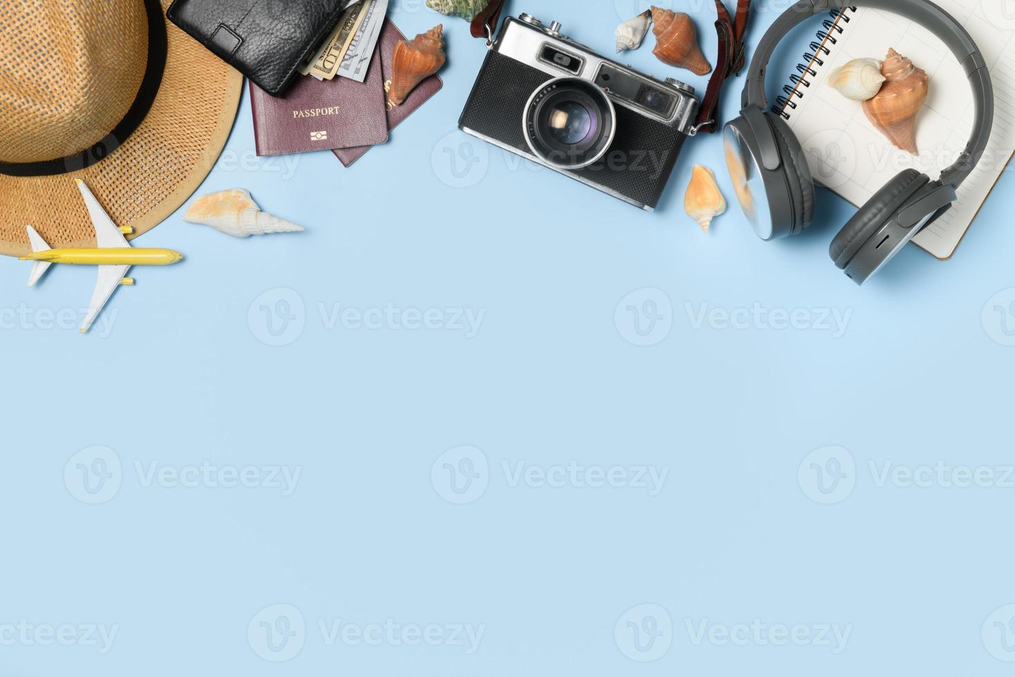 Traveler accessories vintage camera, dollar banknote with wallet headphone and passport photo