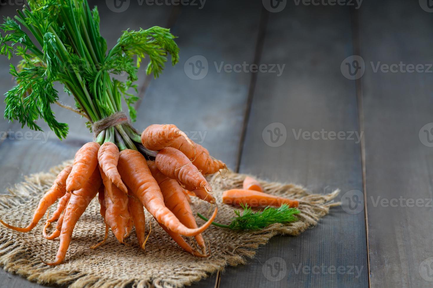 Fresh Baby carrots on wood background, High Beta Carotene photo
