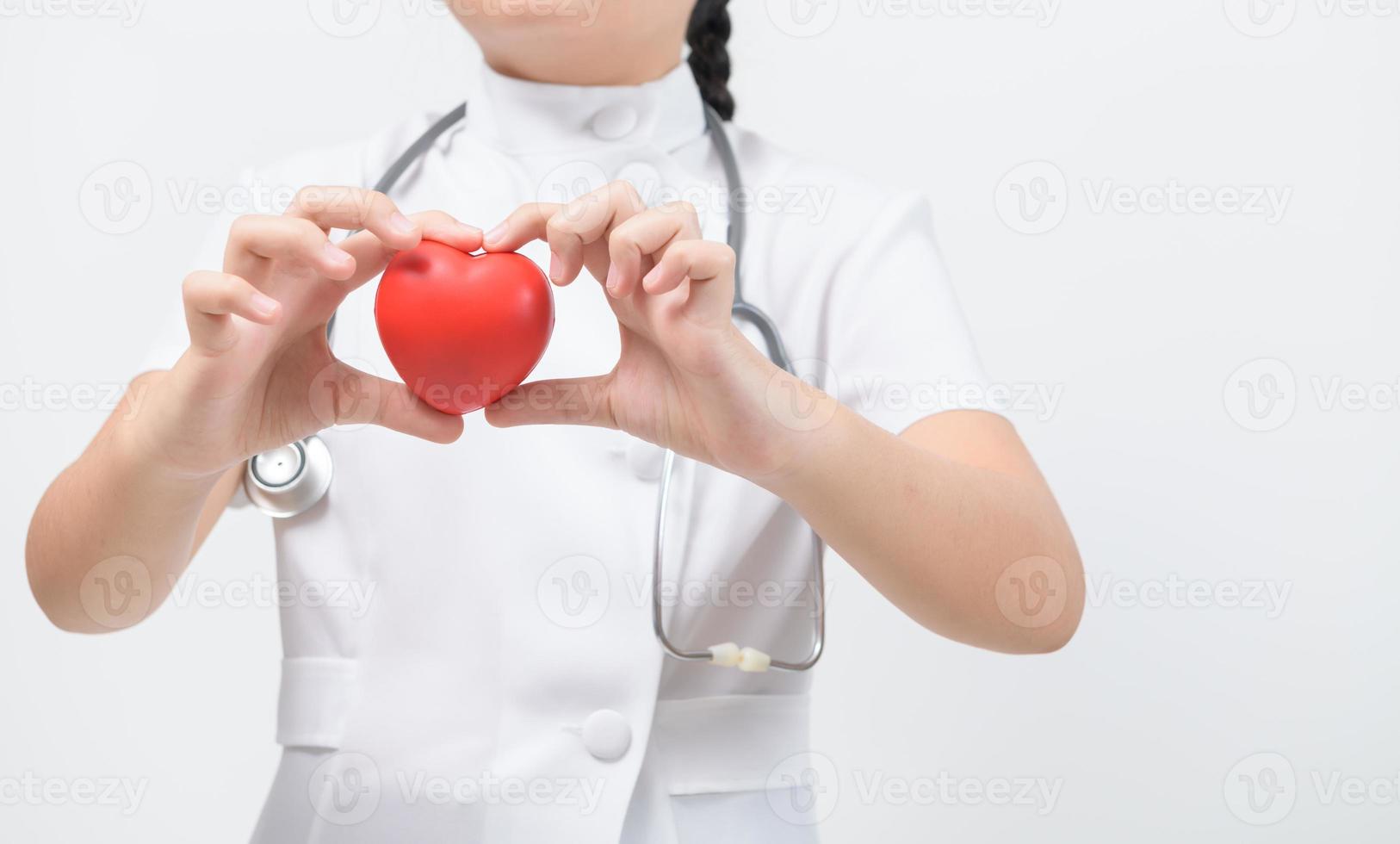 doctor hand holding a red heart isolated on white background, heart health, health insurance photo