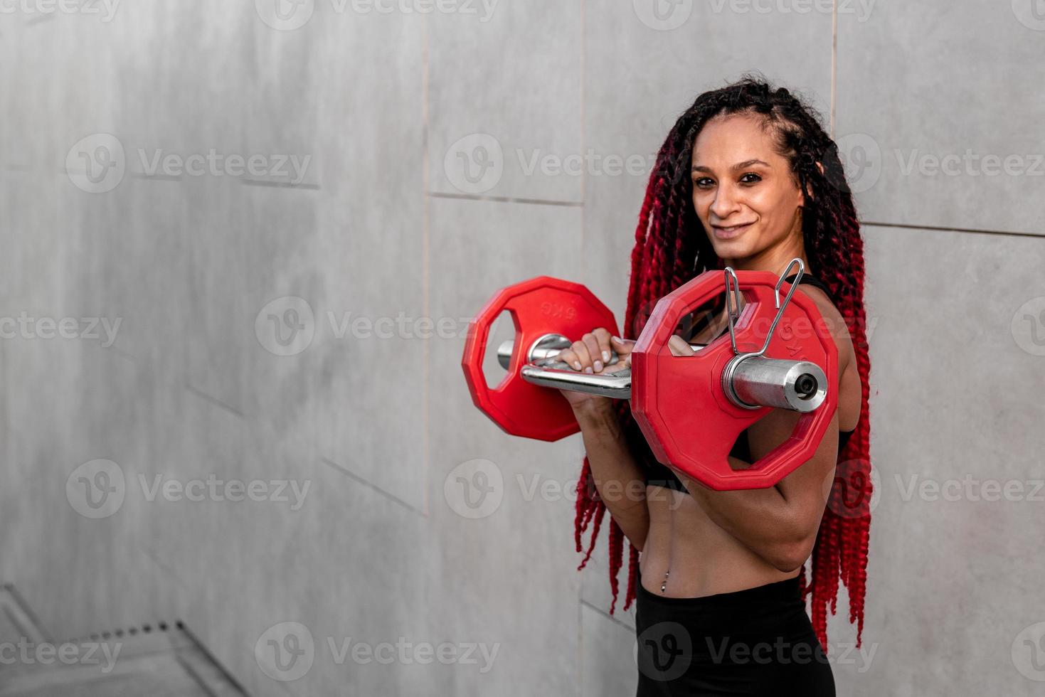 Fitness, body builder and woman with barbell training, workout or