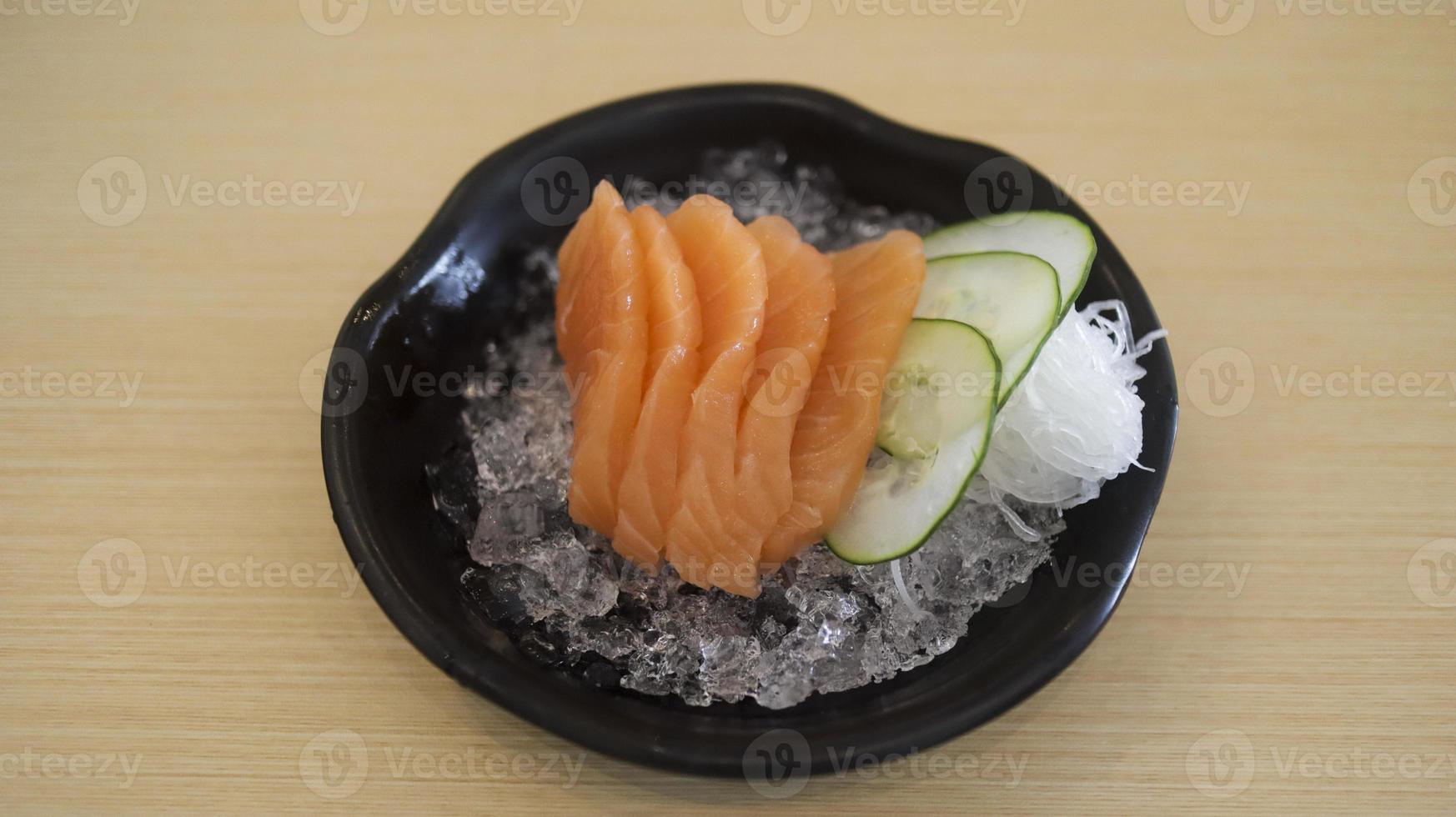 Sliced raw salmon fish or salmon fillet or salmon sashimi as Japanese food restaurant. Asian food Japan sushi restaurant menu. photo