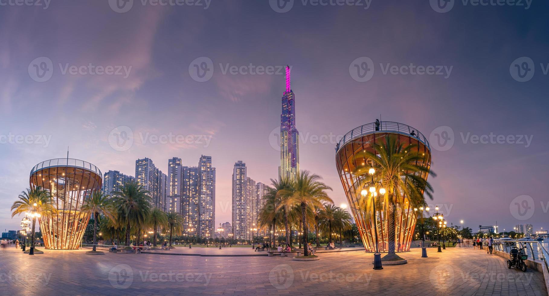 Beautiful night view with colorful sky at Landmark 81 - it is a super tall skyscraper with development buildings along Saigon river in Ho Chi Minh city, Vietnam. photo